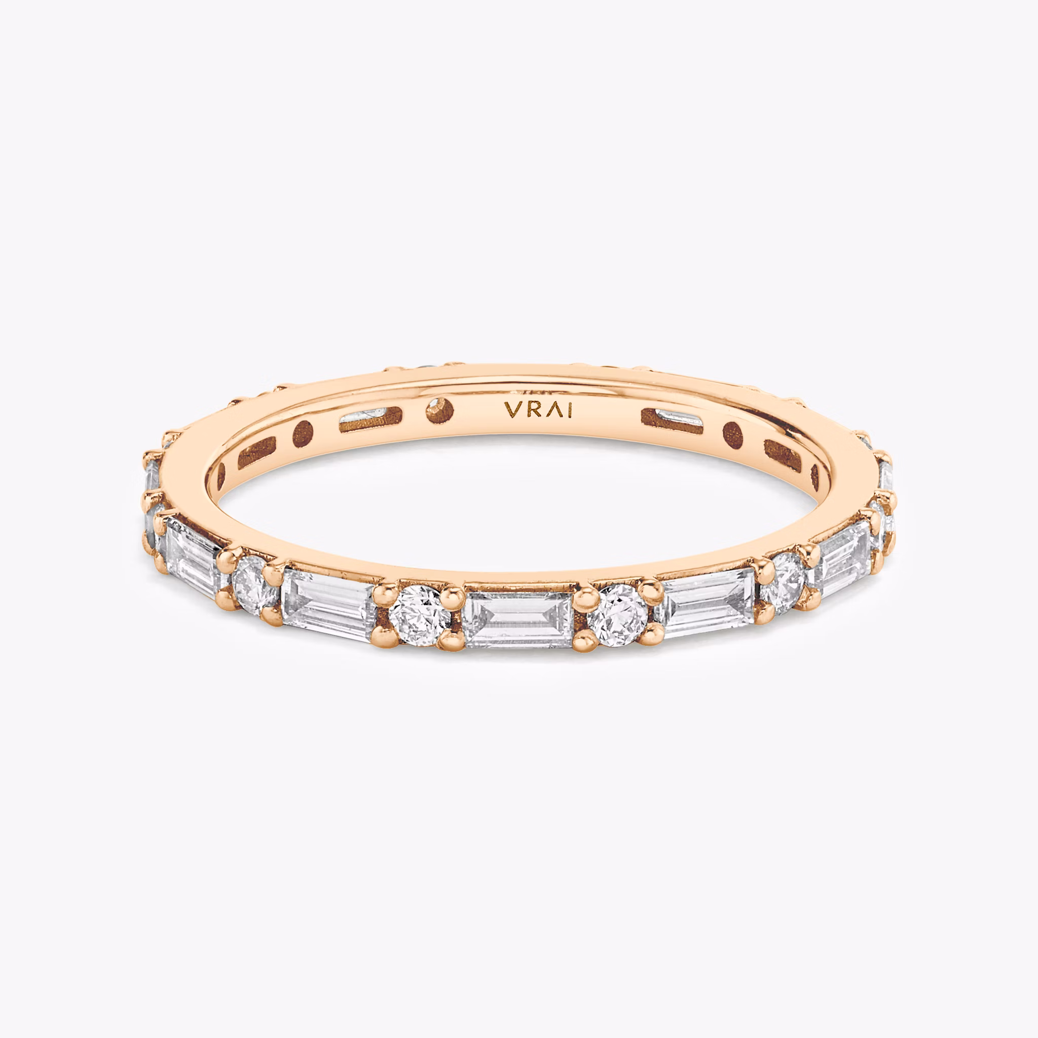 Full eternity rose gold band with alternating round and marquise-shaped diamonds, shown on white background.