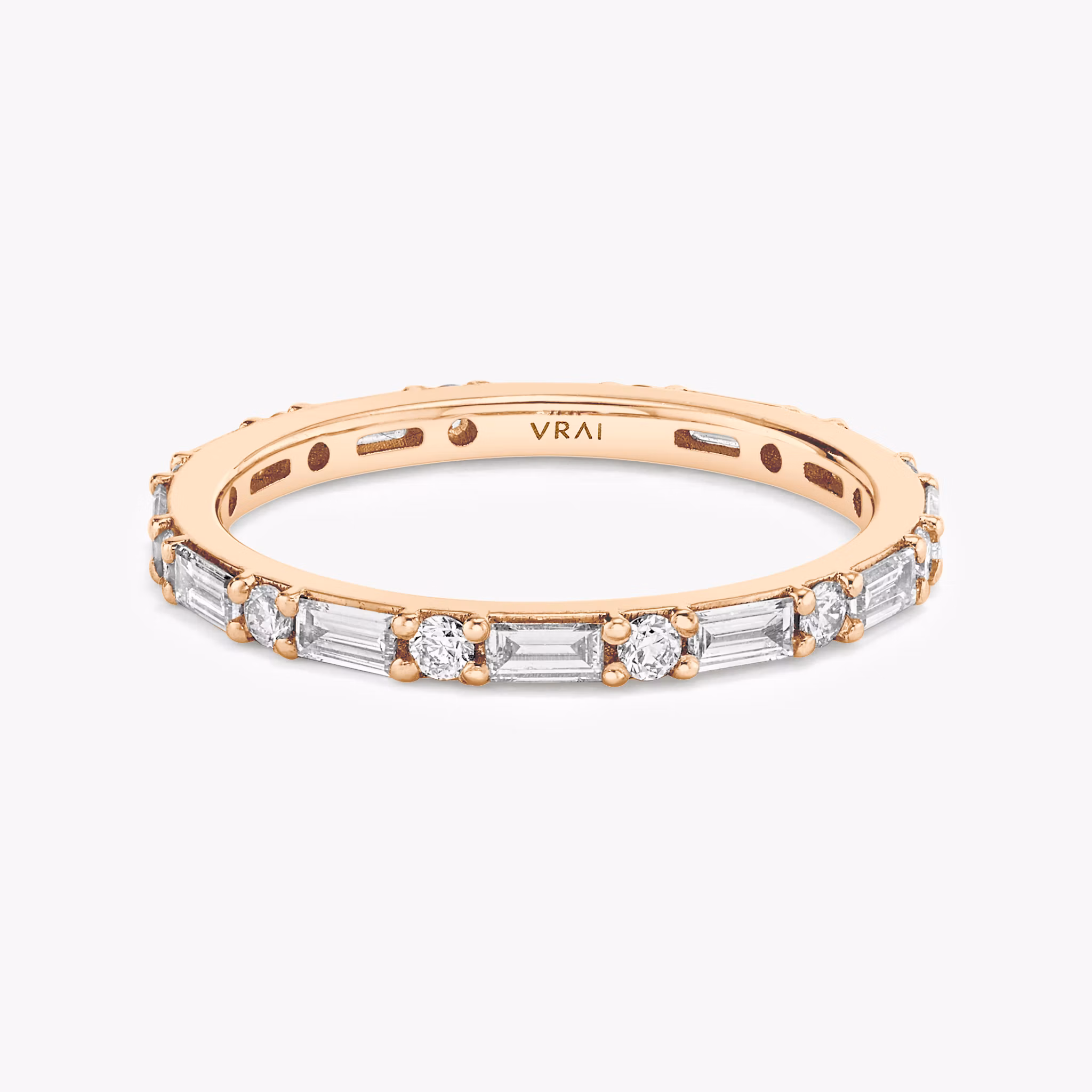 Full eternity rose gold band with alternating round and marquise-shaped diamonds, shown on white background.