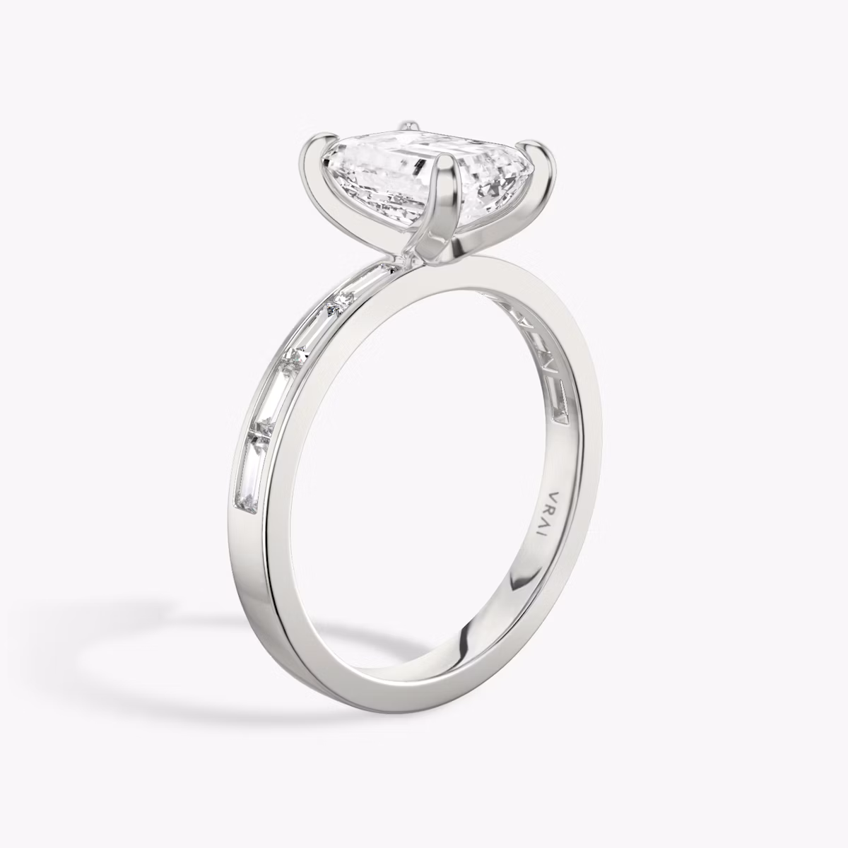 The Devotion | Emerald | Platinum | bandAccent: Pavé | bandStoneShape: Baguette | bandStoneStyle: original | diamondOrientation: vertical | caratWeight: other