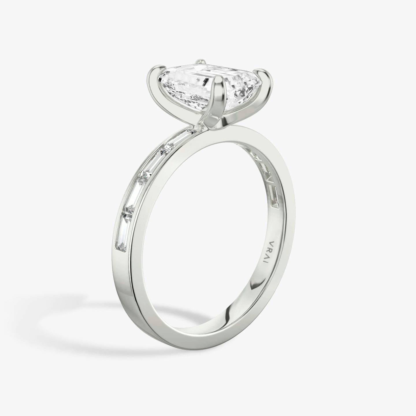 The Devotion | Emerald | Platinum | bandAccent: Pavé | bandStoneShape: Baguette | bandStoneStyle: original | diamondOrientation: vertical | caratWeight: other