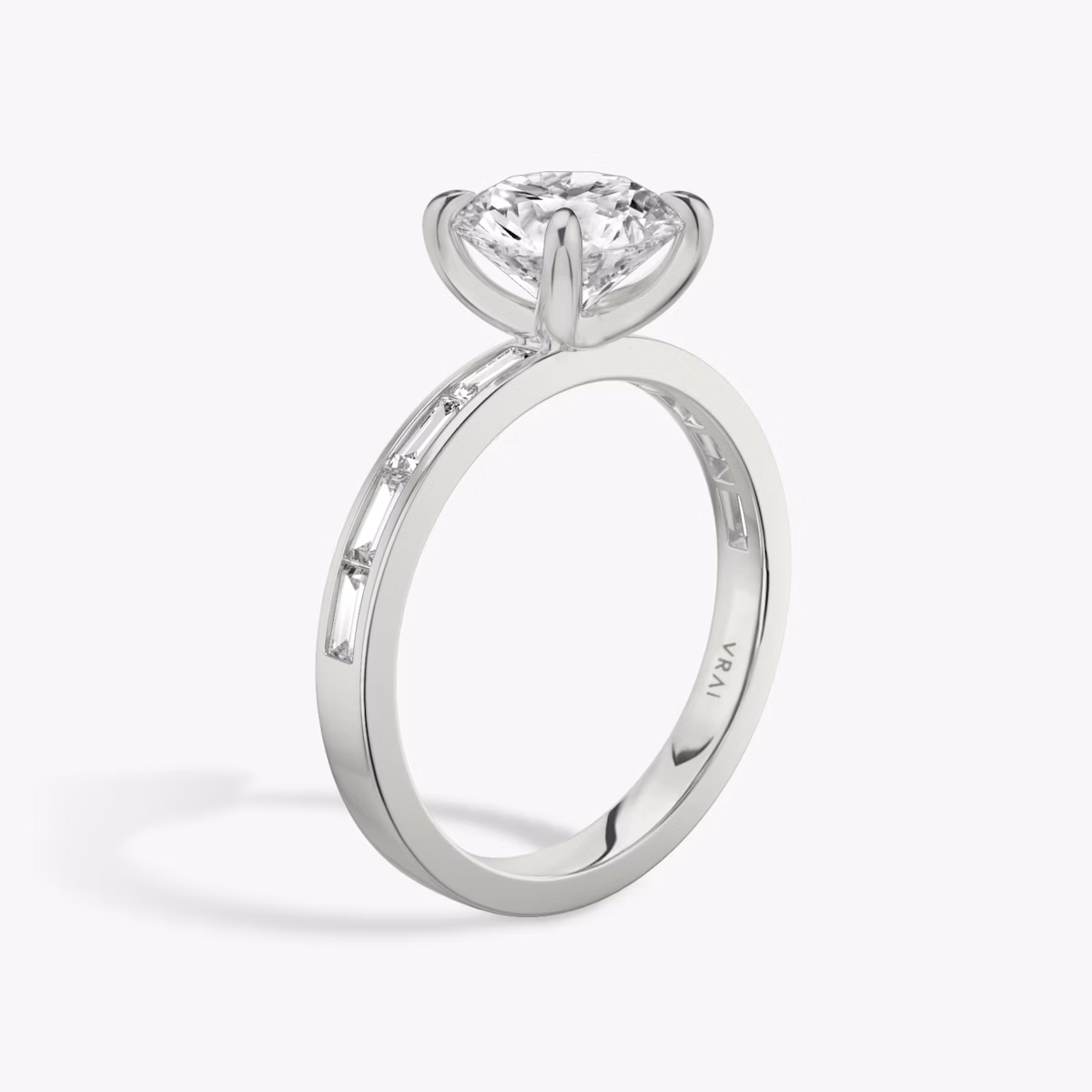 The Devotion | Round Brilliant | 18k | White Gold | bandAccent: Pavé | bandStoneShape: Baguette | bandStoneStyle: original | caratWeight: 1.5ct | diamondOrientation: vertical
