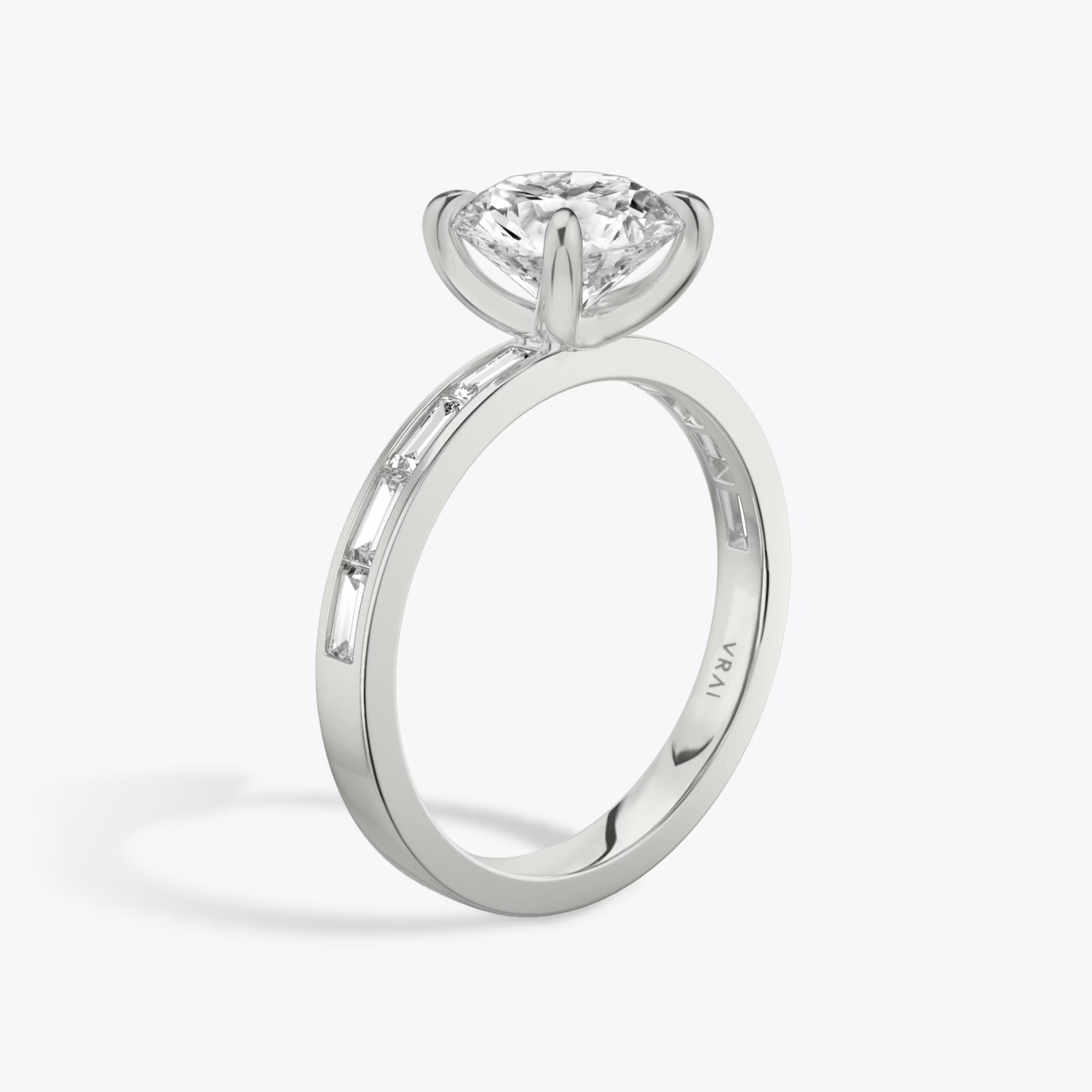 The Devotion | Round Brilliant | Platinum | bandAccent: Pavé | bandStoneShape: Baguette | bandStoneStyle: original | caratWeight: 1.0ct | diamondOrientation: vertical