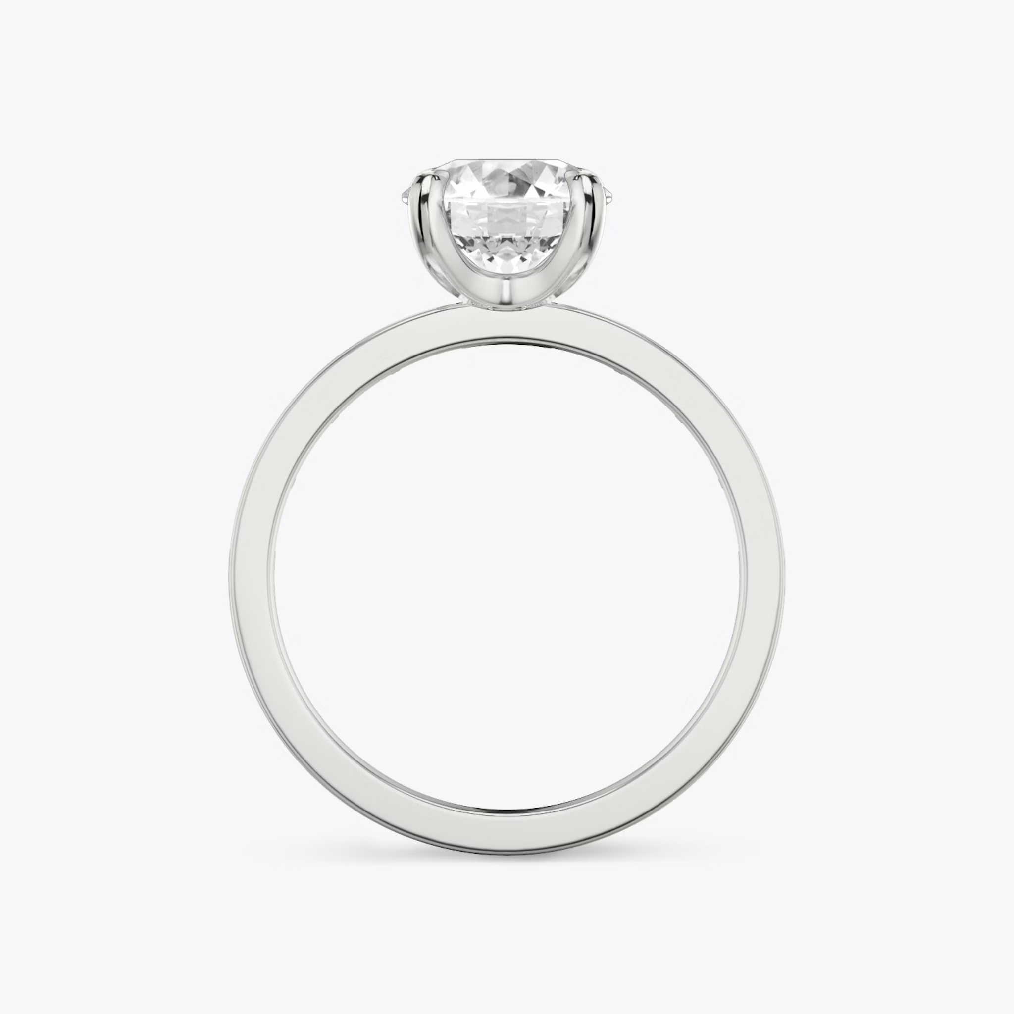 The Devotion | Round Brilliant | Platinum | bandAccent: Pavé | bandStoneShape: Baguette | bandStoneStyle: original | caratWeight: 1.0ct | diamondOrientation: vertical