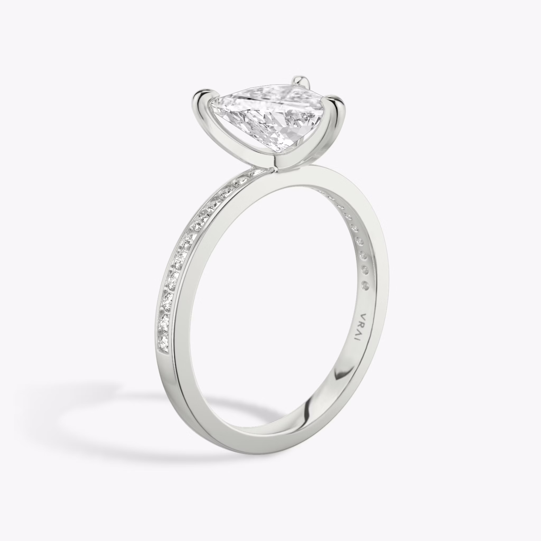 The Devotion | Trillion | Platinum | bandAccent: Pavé | bandStoneShape: Round Brilliant | bandStoneStyle: original | diamondOrientation: vertical | caratWeight: other