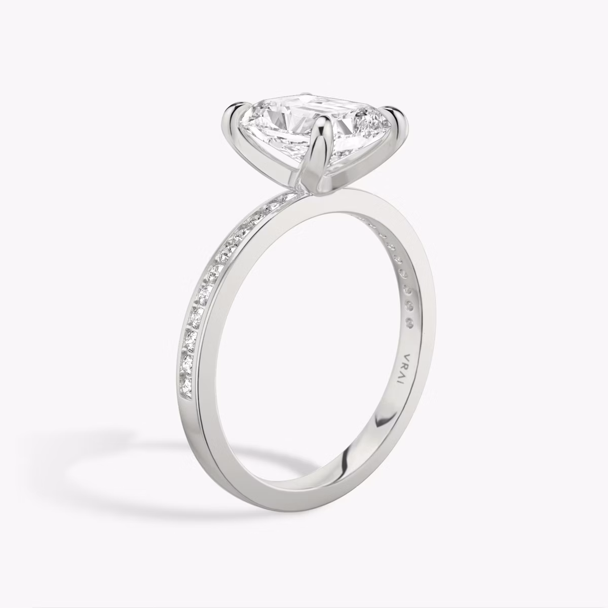 The Devotion | Radiant | Platinum | bandAccent: Pavé | bandStoneShape: Round Brilliant | bandStoneStyle: original | diamondOrientation: vertical | caratWeight: other