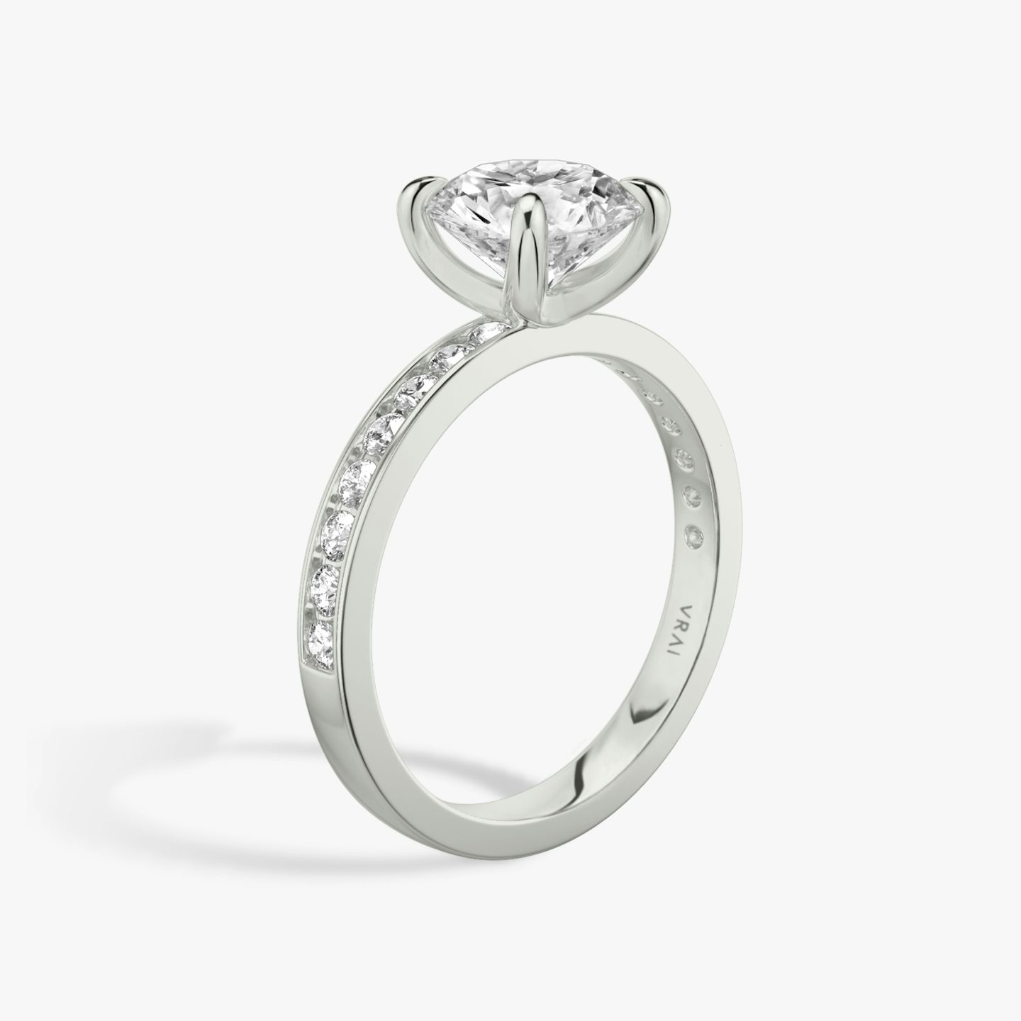 The Devotion | Round Brilliant | 18k | White Gold | bandAccent: Pavé | bandStoneShape: Round Brilliant | bandStoneStyle: large | caratWeight: 1.0ct | diamondOrientation: vertical