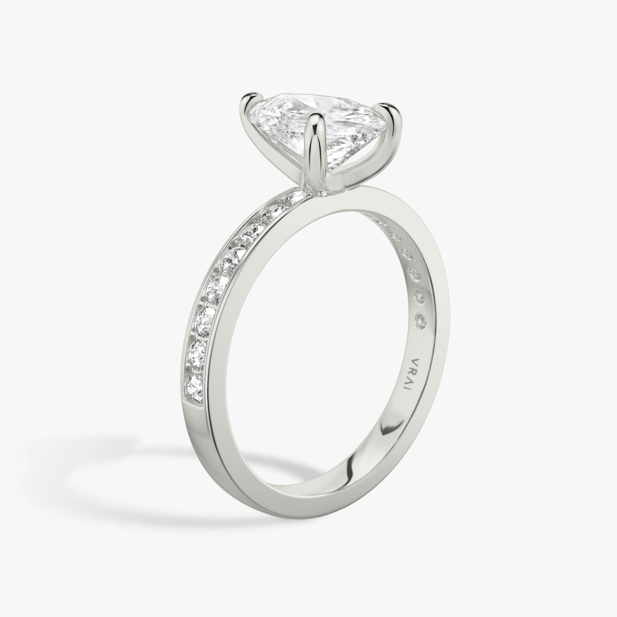 The Devotion | Pear | 18k | White Gold | bandAccent: Pavé | bandStoneShape: Round Brilliant | bandStoneStyle: large | diamondOrientation: vertical | caratWeight: other
