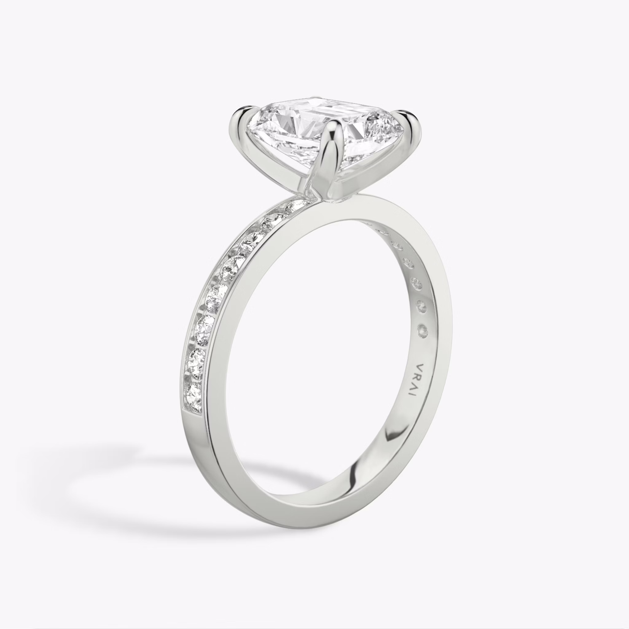 The Devotion | Radiant | Platinum | bandAccent: Pavé | bandStoneShape: Round Brilliant | bandStoneStyle: large | diamondOrientation: vertical | caratWeight: other