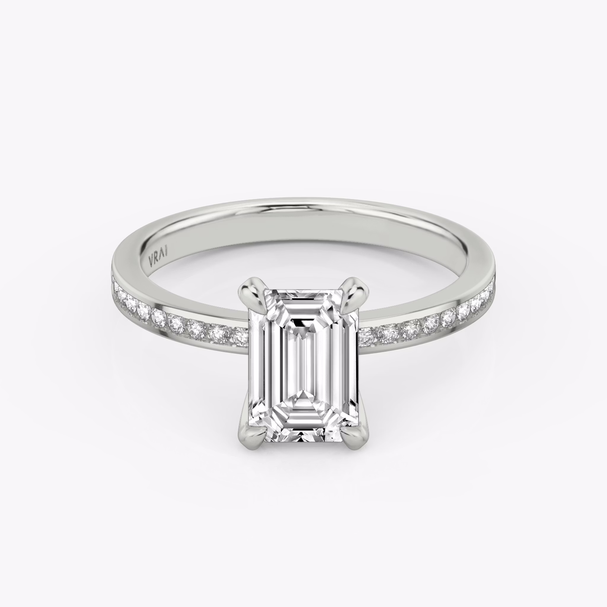 The Devotion | Emerald | Platinum | bandAccent: Pavé | bandStoneShape: Round Brilliant | bandStoneStyle: original | diamondOrientation: vertical | caratWeight: other