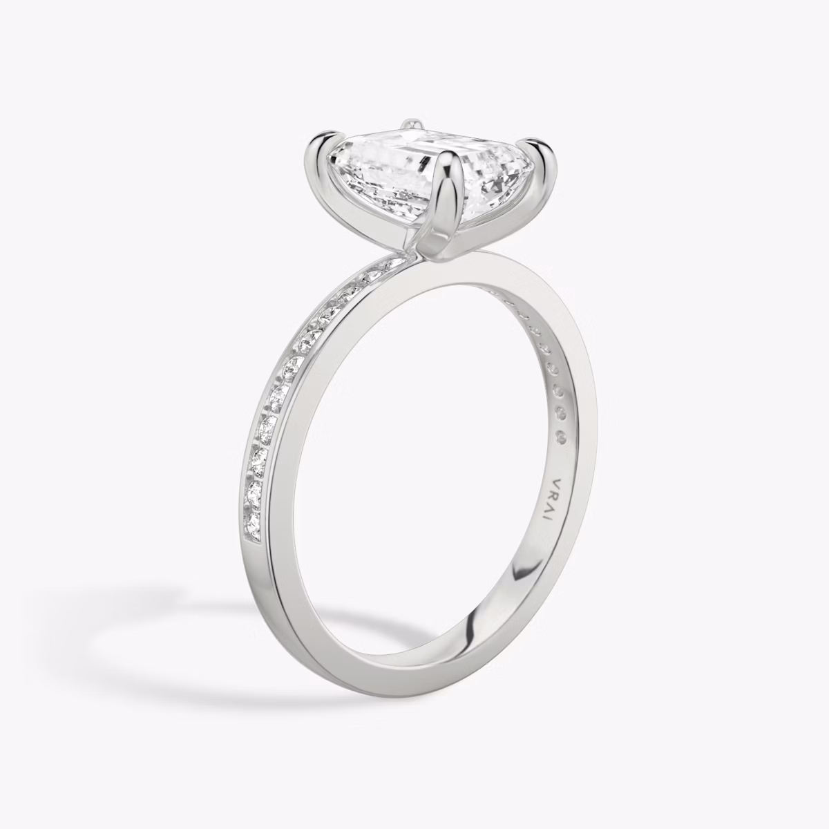 The Devotion | Emerald | 18k | White Gold | bandAccent: Pavé | bandStoneShape: Round Brilliant | bandStoneStyle: original | diamondOrientation: vertical | caratWeight: other