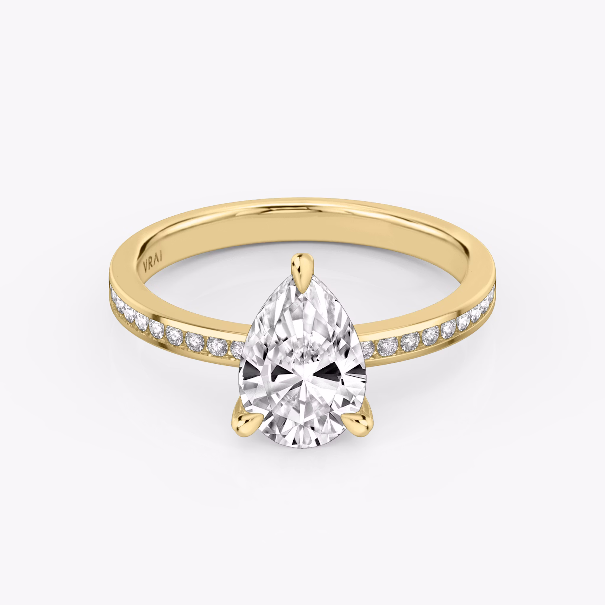 Front view of the devotion pear yellow gold engagement ring