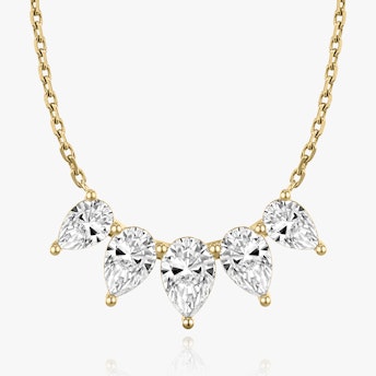 The Pear Arc Necklace in yellow gold.