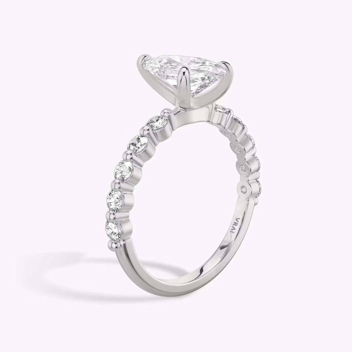 The Single Shared Prong | Pear | Platinum | bandAccent: Plain | bandStoneStyle: large | diamondOrientation: vertical | caratWeight: other