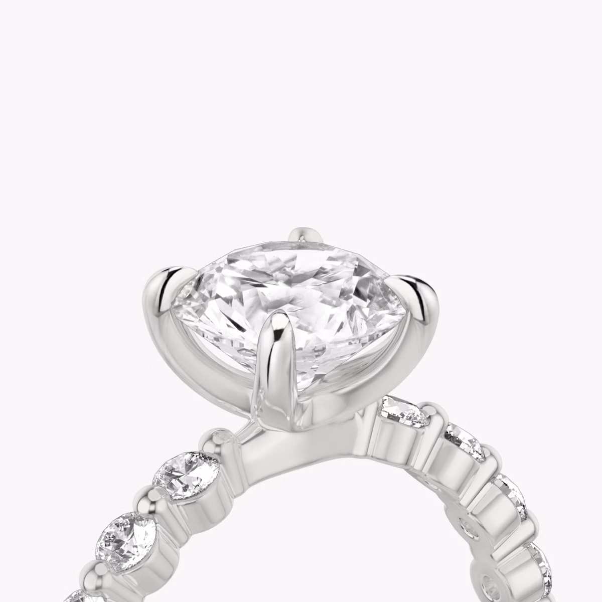 The Single Shared Prong | Round Brilliant | Platinum | bandAccent: Plain | bandStoneStyle: large | caratWeight: other | diamondOrientation: vertical
