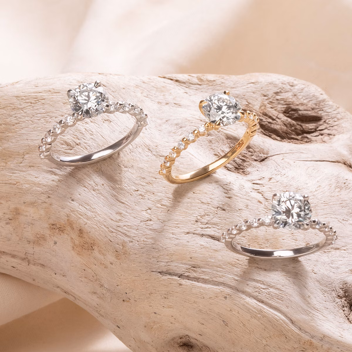 The Single Shared Prong | Round Brilliant | Platinum | bandAccent: Plain | bandStoneStyle: large | caratWeight: other | diamondOrientation: vertical