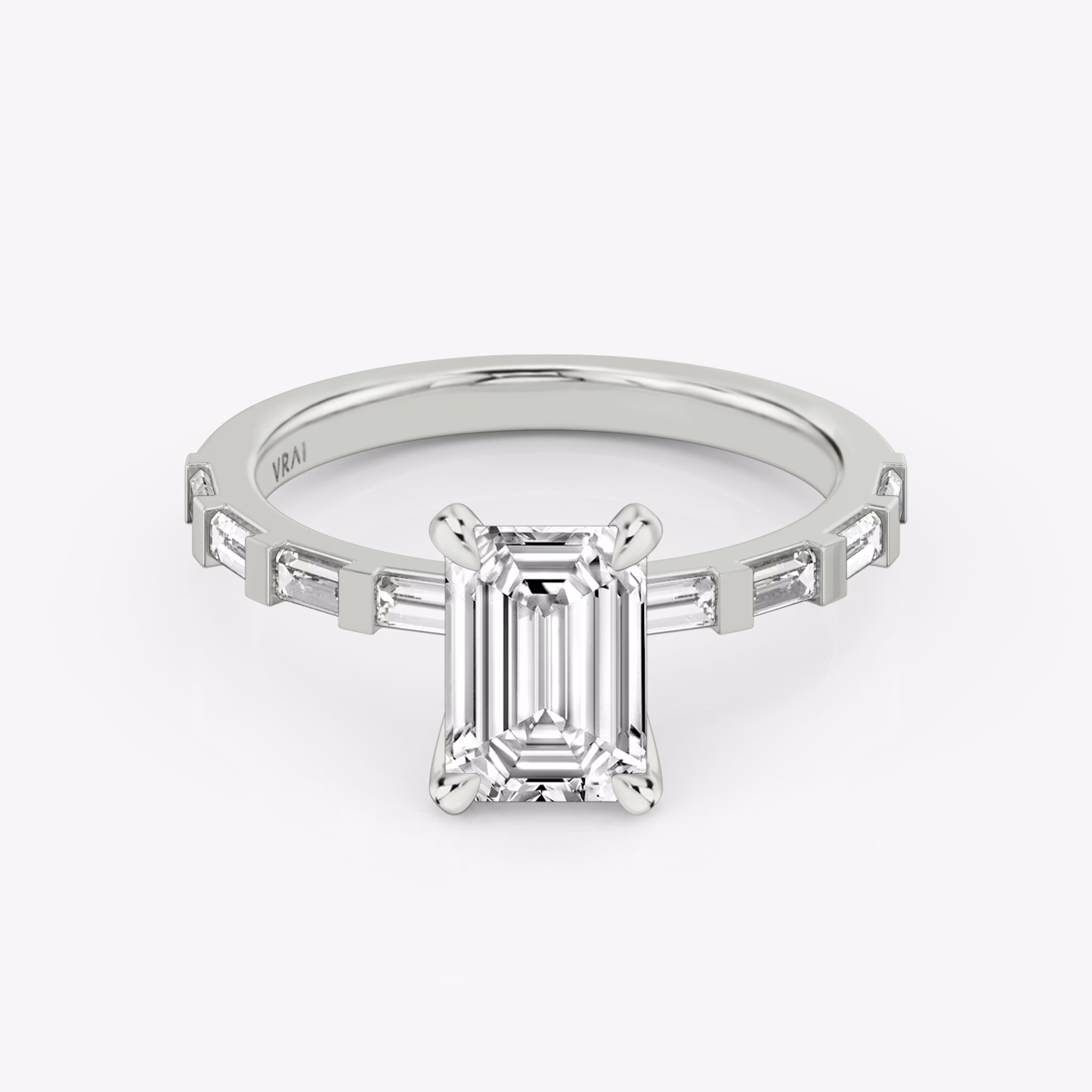 The Baguette Bar Emerald White Gold Engagement Ring.