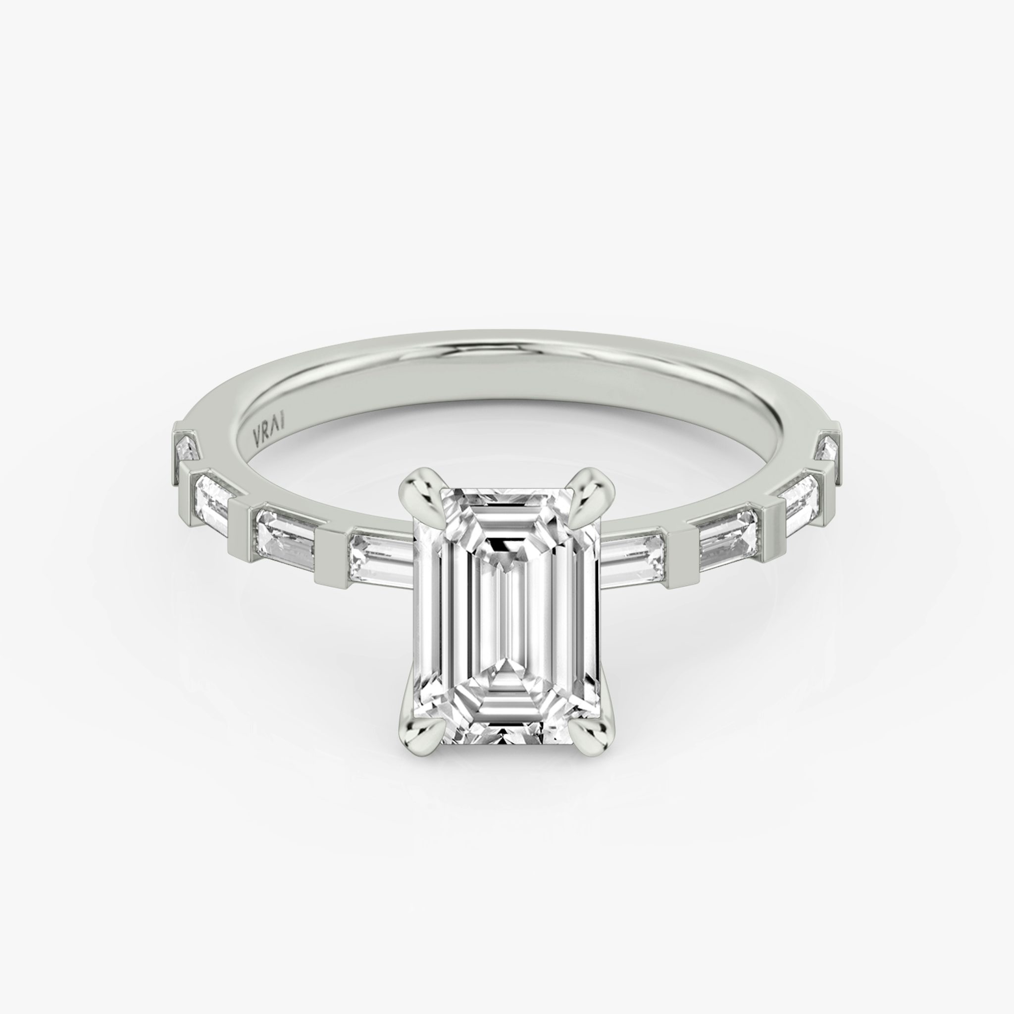 The Baguette Bar Emerald White Gold Engagement Ring.