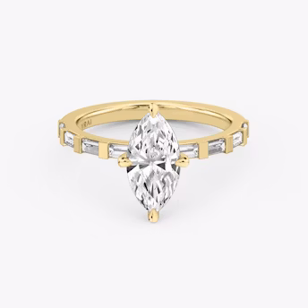 The Baguette Bar Marquise Yellow Gold Engagement Ring laying flat.