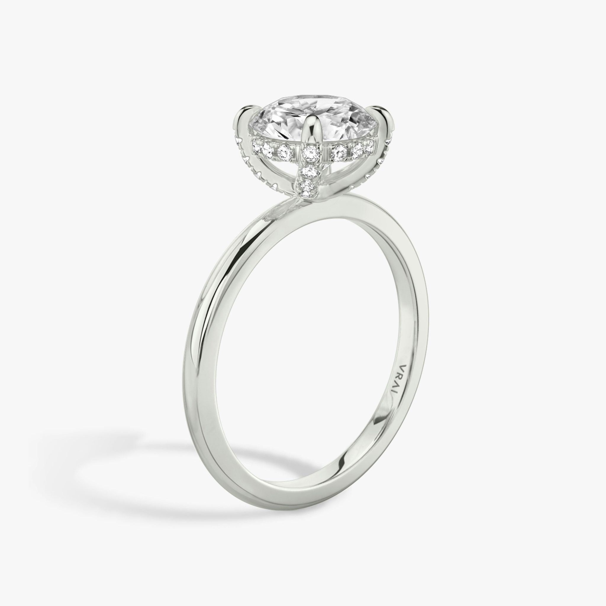The Classic Hidden Halo | Round Brilliant | Platinum | bandAccent: Plain | bandWidth: standard | caratWeight: other | prongStyle: Pavé | diamondOrientation: vertical