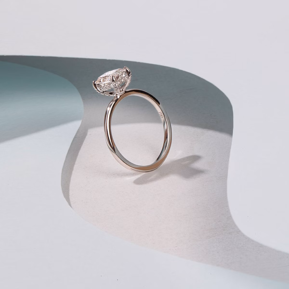 The Classic Hidden Halo | Radiant | 18k | White Gold | bandAccent: Plain | bandWidth: standard | prongStyle: Pavé | diamondOrientation: vertical | caratWeight: other