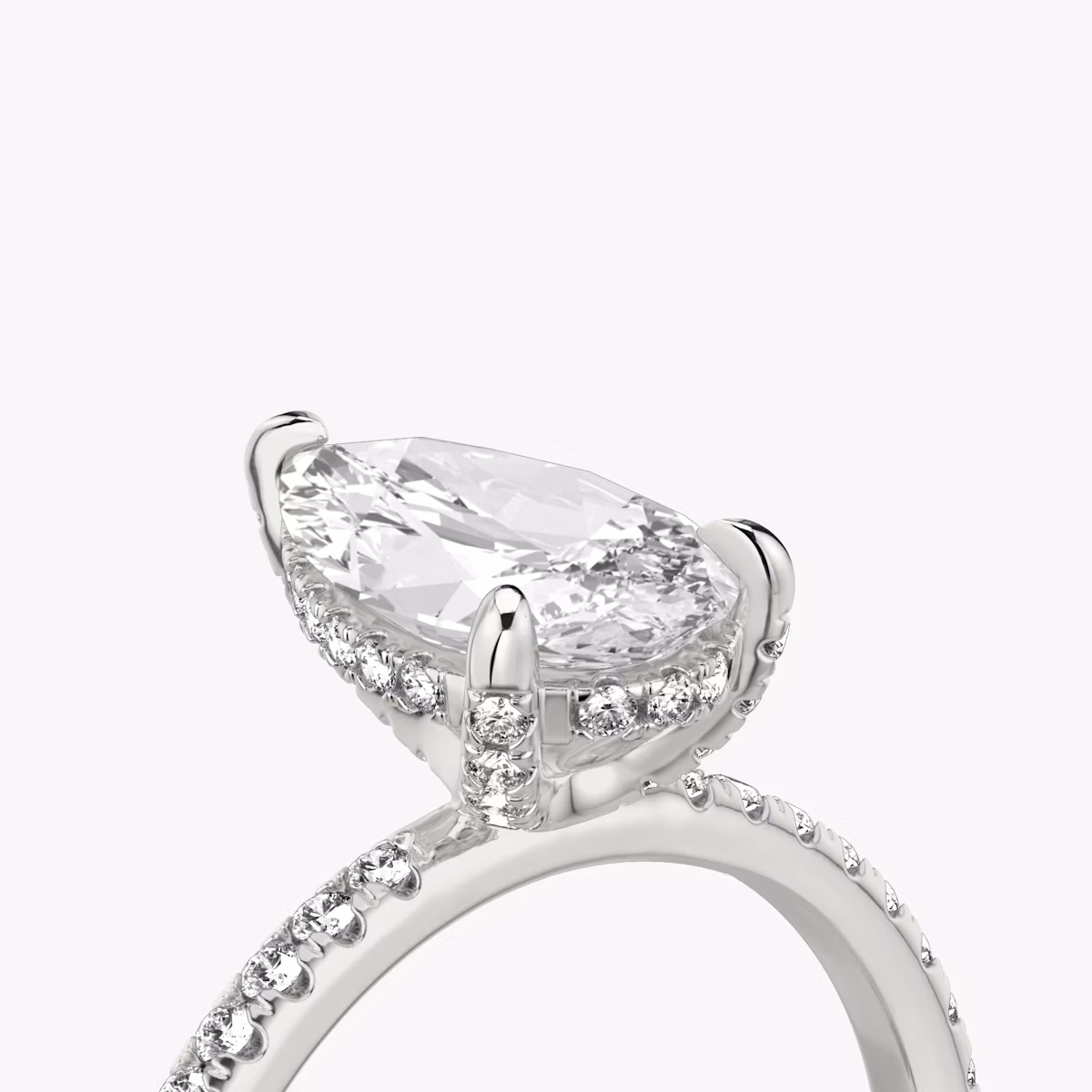 The Classic Hidden Halo | Pear | 18k | White Gold | bandAccent: Pavé | bandWidth: standard | prongStyle: Pavé | diamondOrientation: vertical | caratWeight: other
