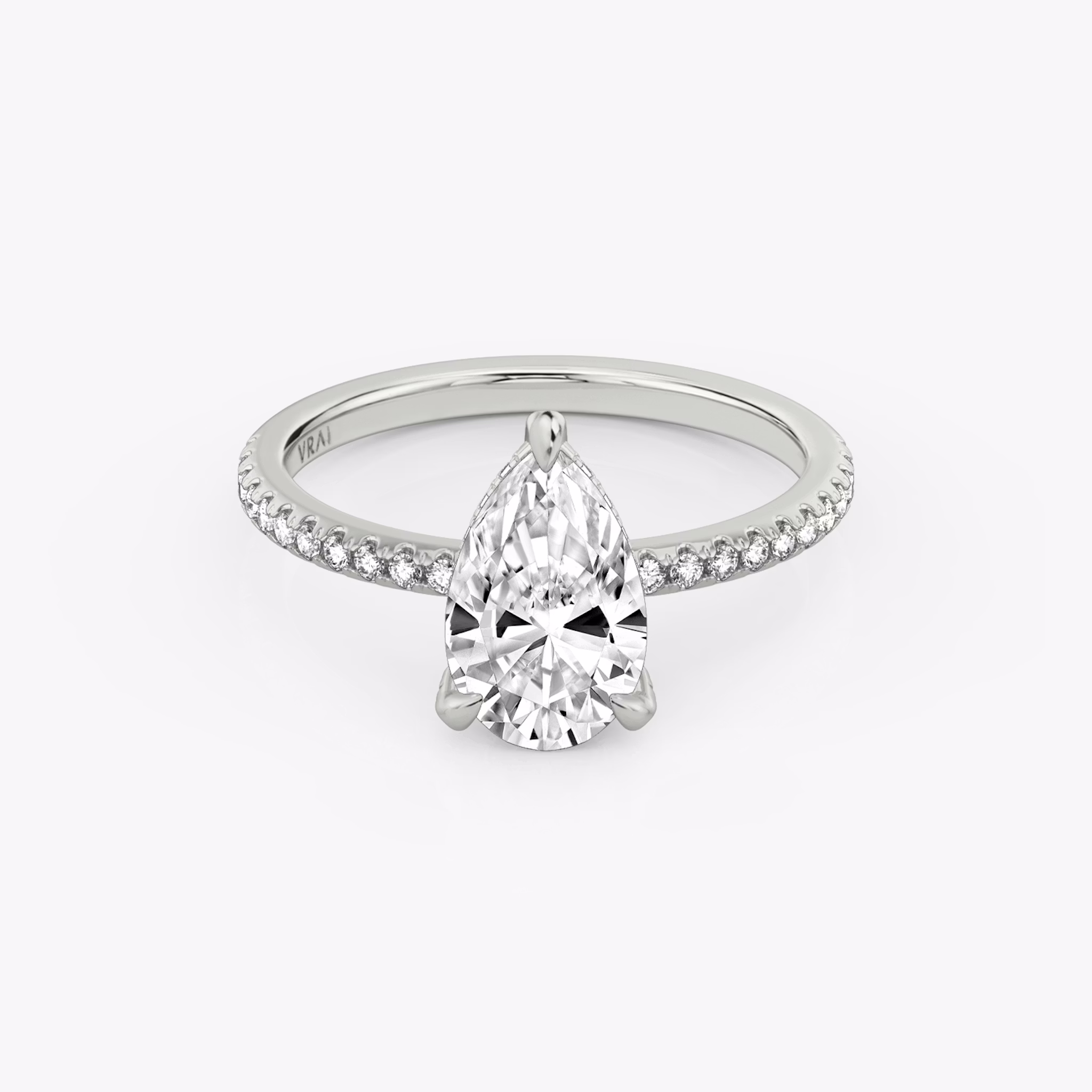 The Classic Hidden Halo | Pear | 18k | White Gold | bandAccent: Pavé | bandWidth: standard | prongStyle: Pavé | diamondOrientation: vertical | caratWeight: other