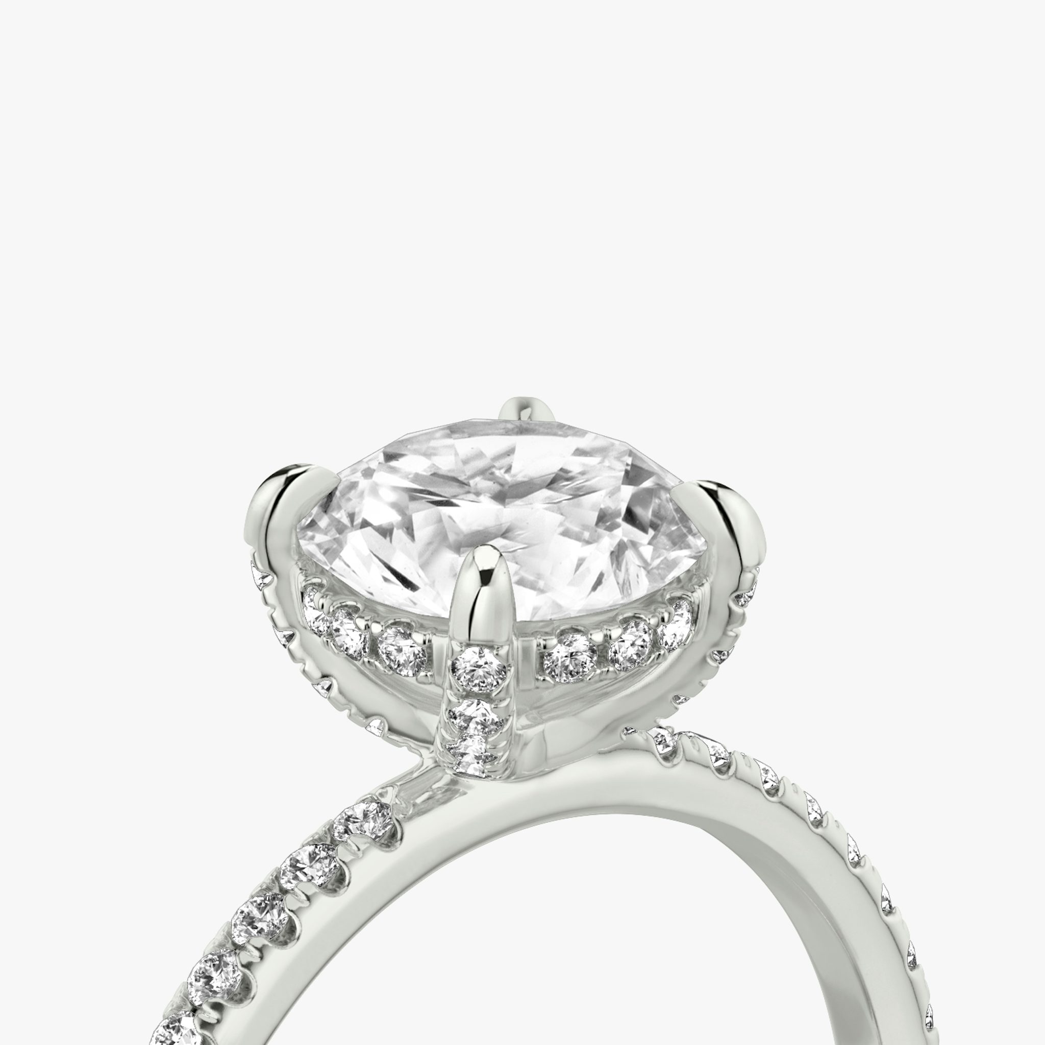 The Classic Hidden Halo | Round Brilliant | 18k | White Gold | bandAccent: Pavé | bandWidth: standard | caratWeight: other | prongStyle: Pavé | diamondOrientation: vertical