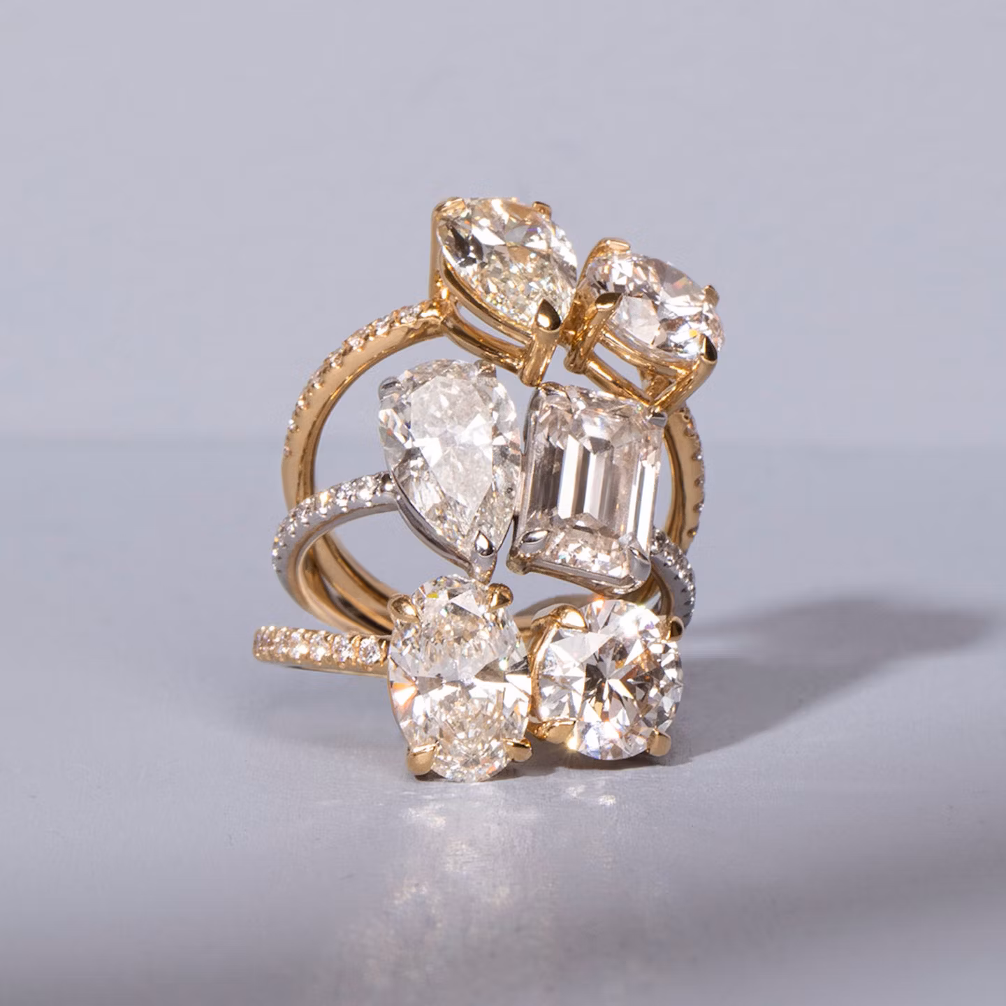 The Toi et Moi | Emerald and Pear | Platinum | bandAccent: Pavé | diamondOrientation: vertical | caratWeight: other