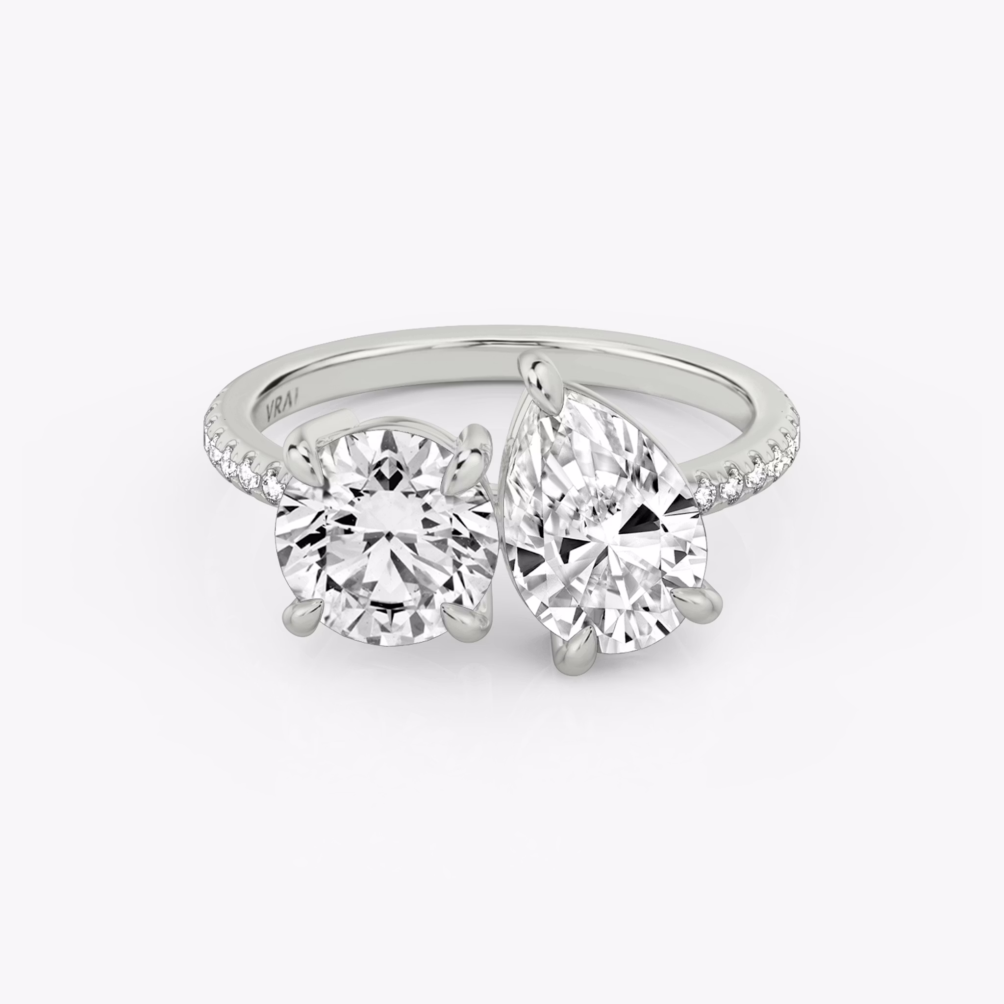 The Toi et Moi | Round Brilliant and Pear | Platinum | bandAccent: Pavé | diamondOrientation: vertical | caratWeight: other