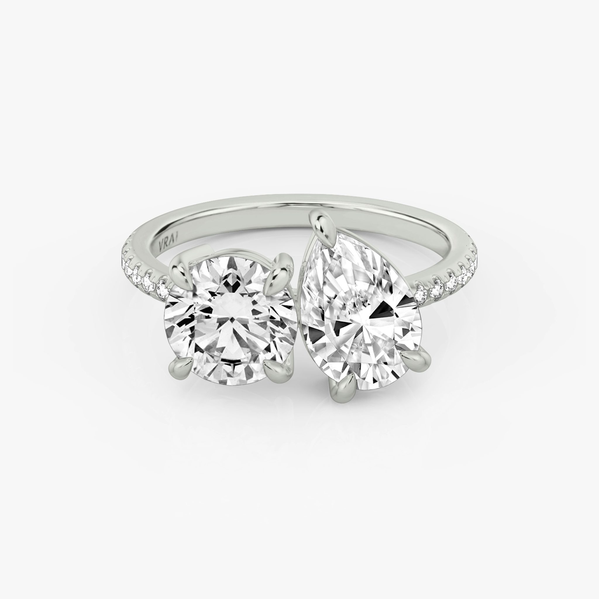 The Toi et Moi | Round Brilliant and Pear | Platinum | bandAccent: Pavé | diamondOrientation: vertical | caratWeight: other