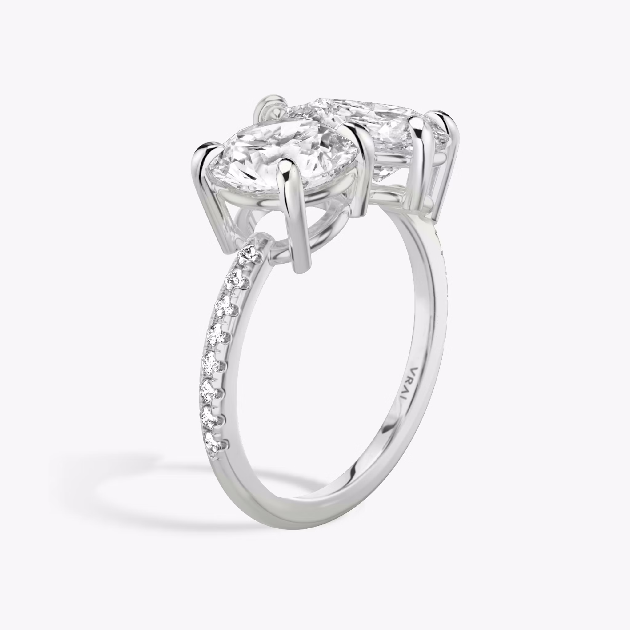 The Toi et Moi | Round Brilliant and Pear | Platinum | bandAccent: Pavé | diamondOrientation: vertical | caratWeight: other