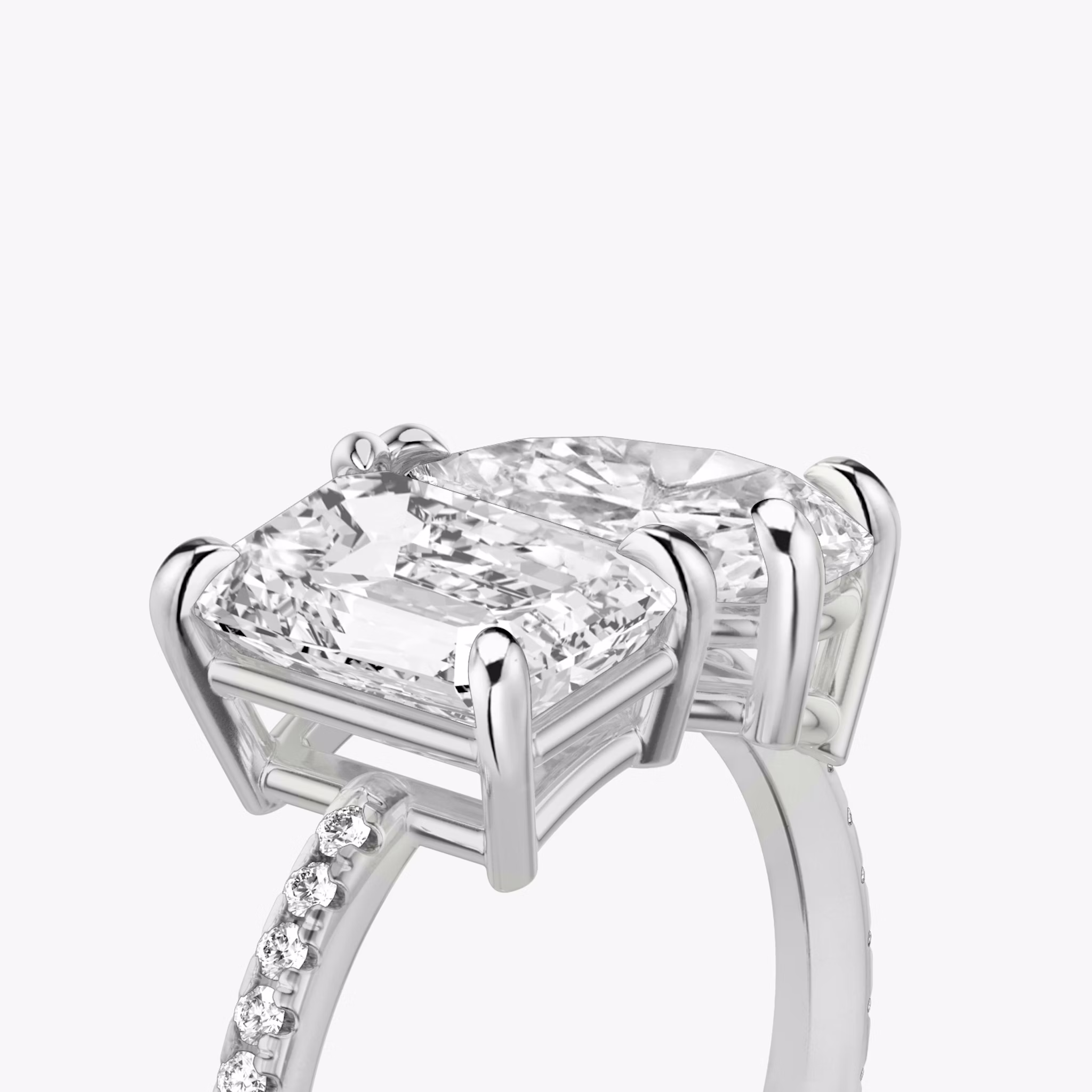 The Toi et Moi | Emerald and Pear | Platinum | bandAccent: Pavé | diamondOrientation: vertical | caratWeight: other