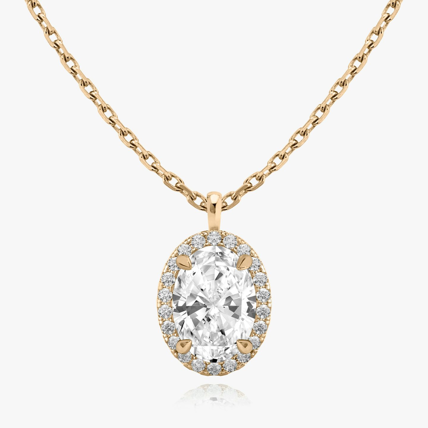 Close-up of a chain necklace with an oval halo diamond pendant in rose gold.