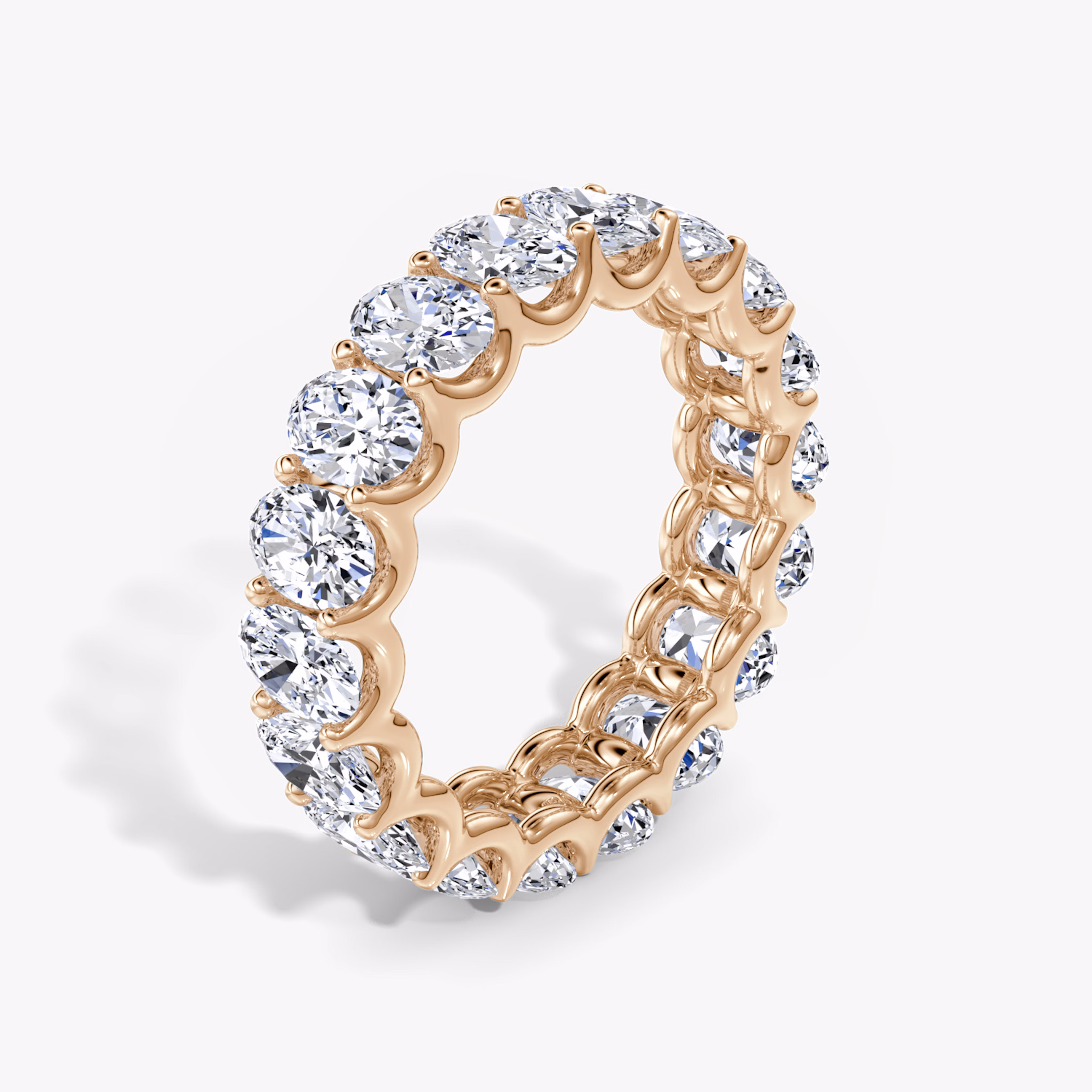 Oval diamond rose gold eternity rings