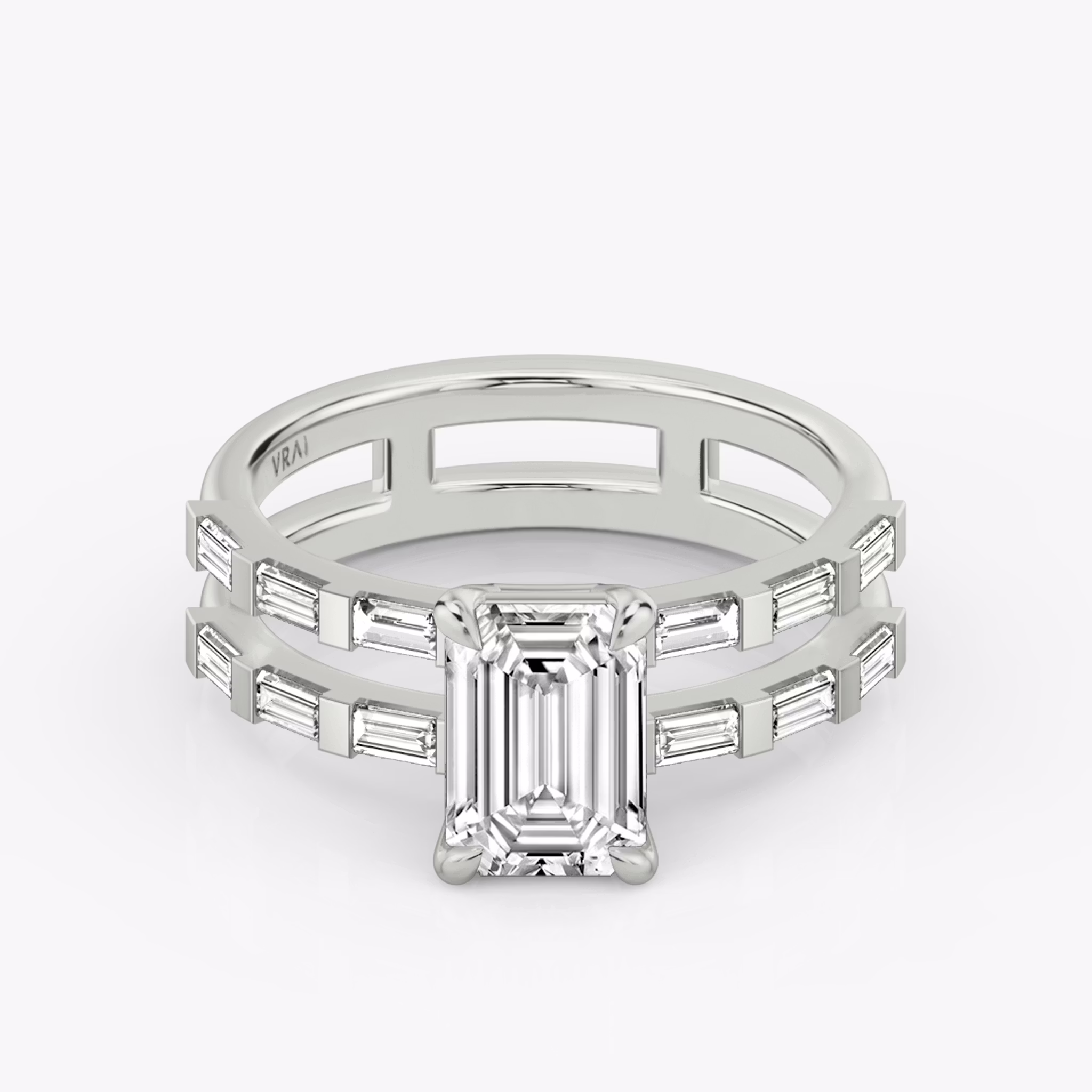 The Double Band | Emerald | Platinum | bandAccent: Pavé | bandStoneShape: Baguette | diamondOrientation: vertical | caratWeight: other