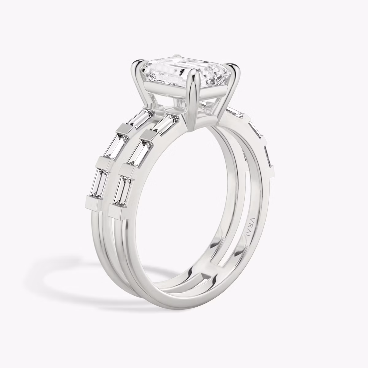 The Double Band | Emerald | Platinum | bandAccent: Pavé | bandStoneShape: Baguette | diamondOrientation: vertical | caratWeight: other