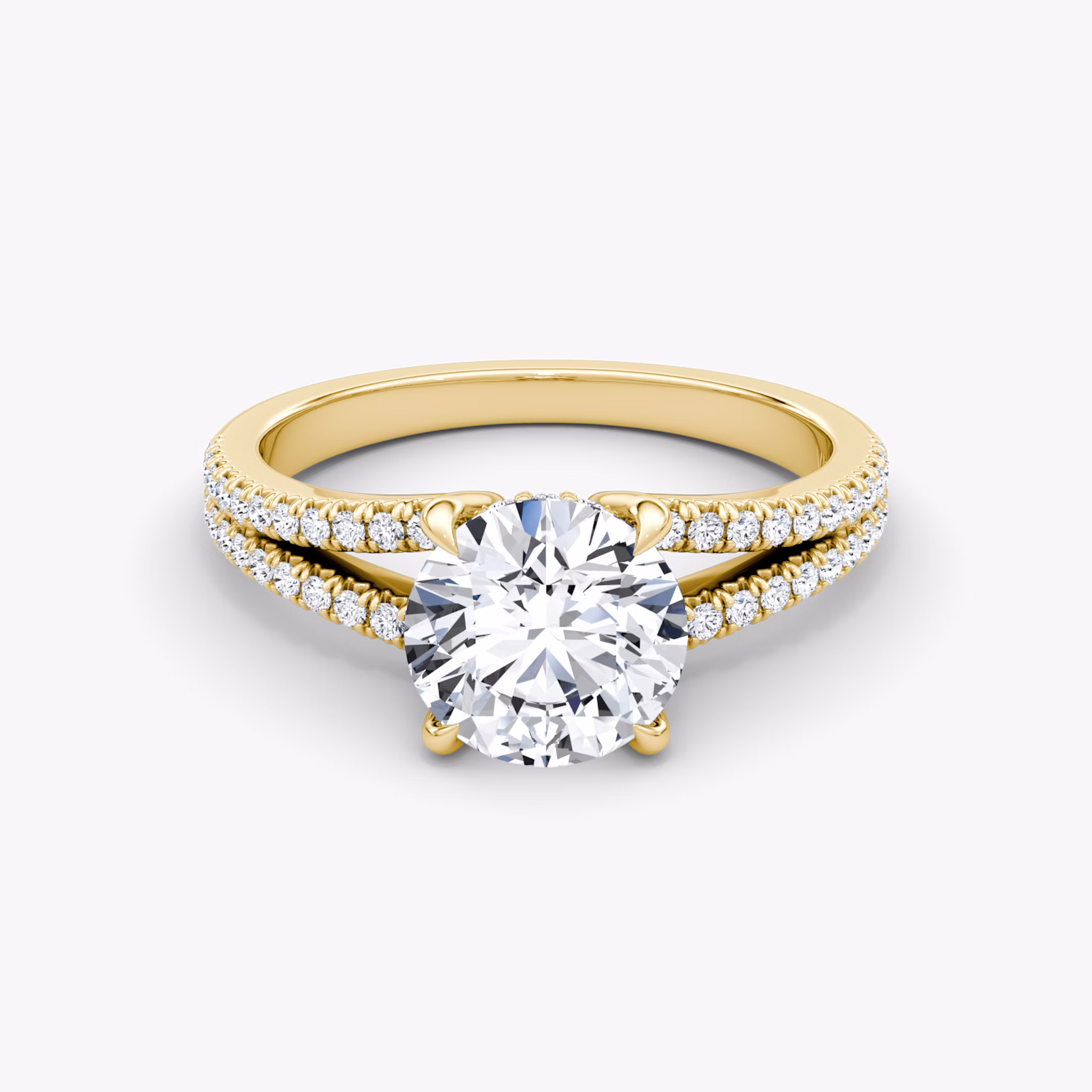 A gold engagement ring with round diamonds.
