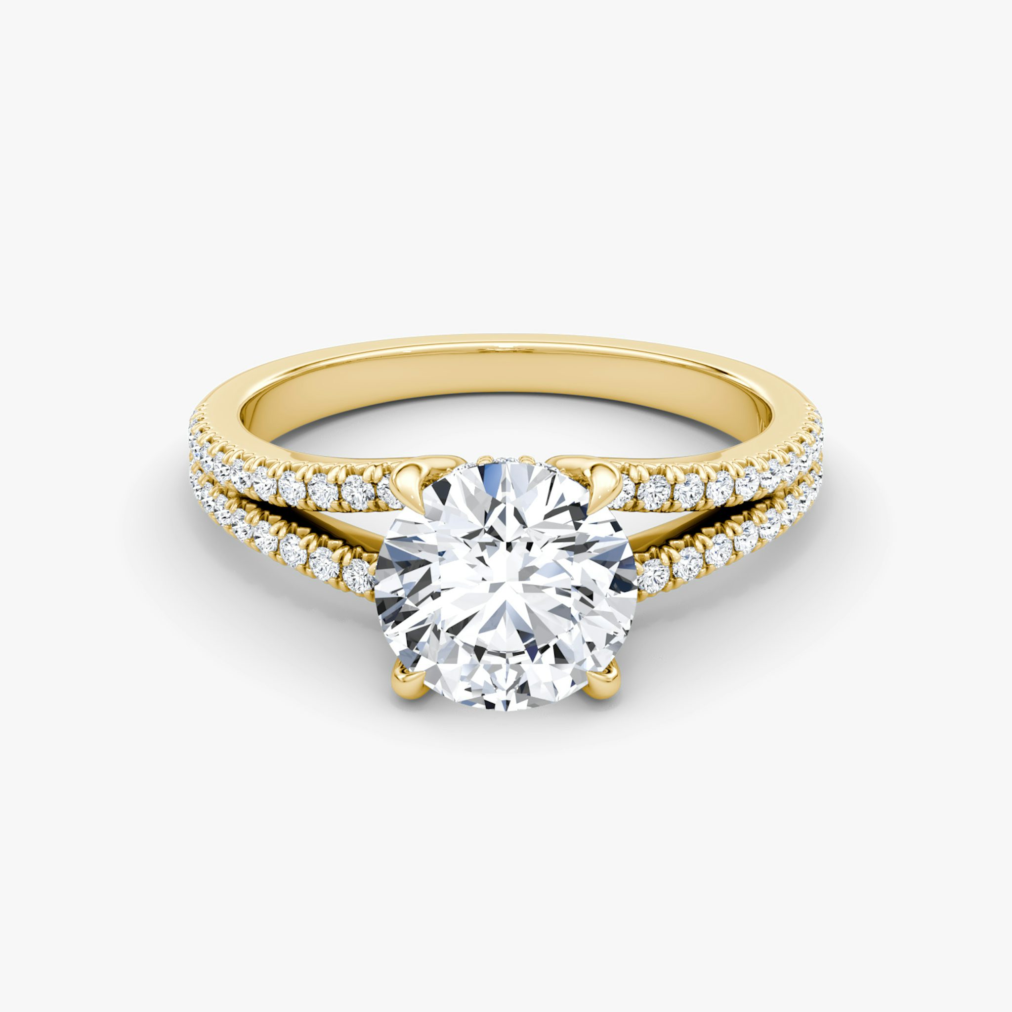 A gold engagement ring with round diamonds.
