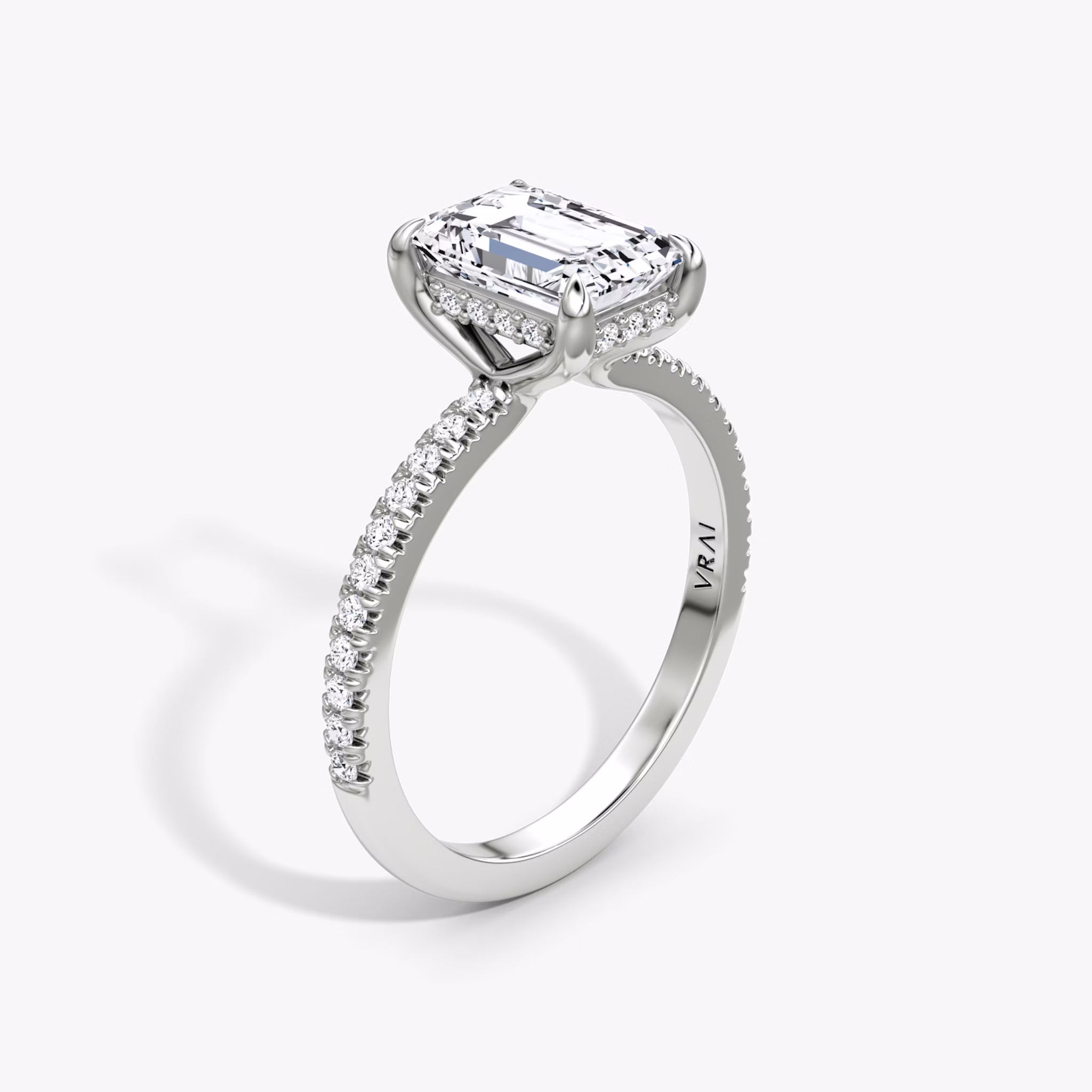 The Floating Solitaire | Emerald | Platinum | bandAccent: Pavé | diamondOrientation: vertical | caratWeight: other
