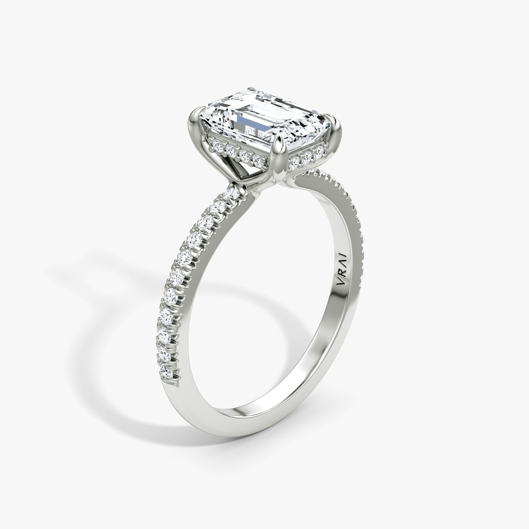 The Floating Solitaire | Emerald | Platinum | bandAccent: Pavé | diamondOrientation: vertical | caratWeight: other