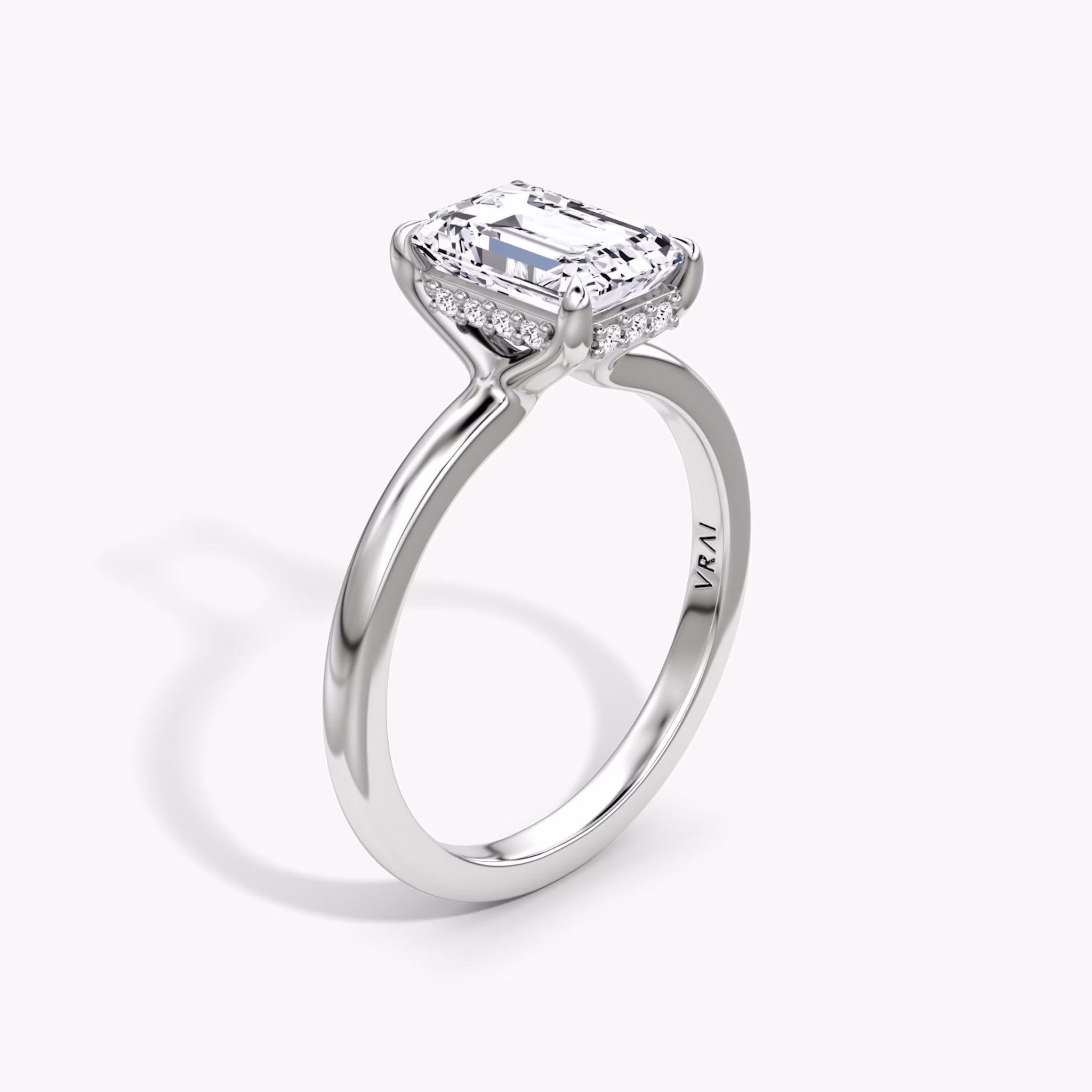 The Floating Solitaire Emerald White Gold Engagement Ring.