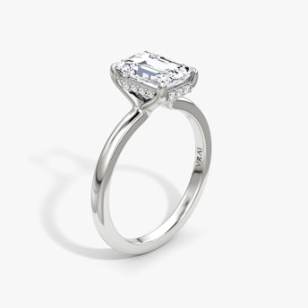 The Floating Solitaire Emerald White Gold Engagement Ring.