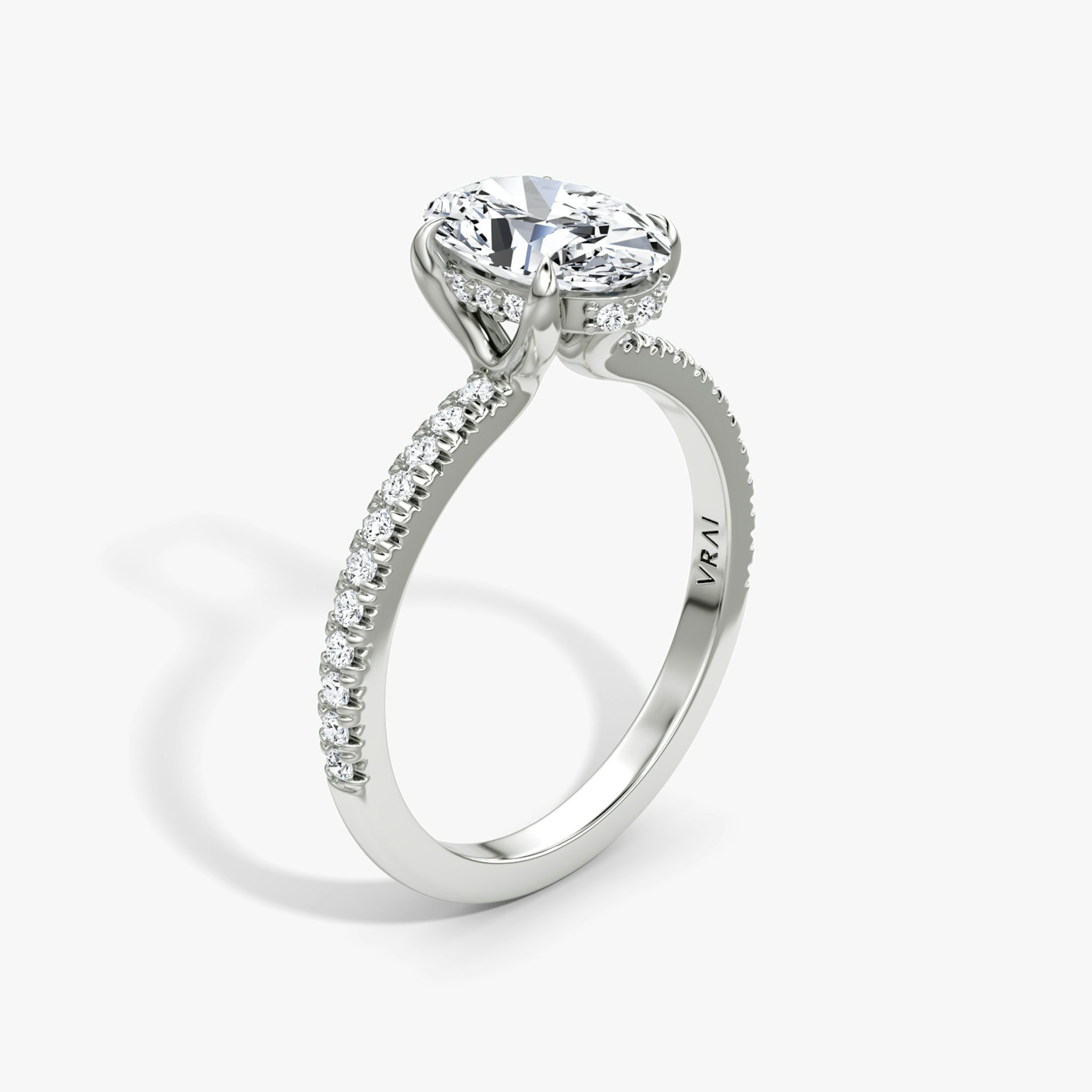The Floating Solitaire | Oval | Platinum | bandAccent: Pavé | diamondOrientation: vertical | caratWeight: other