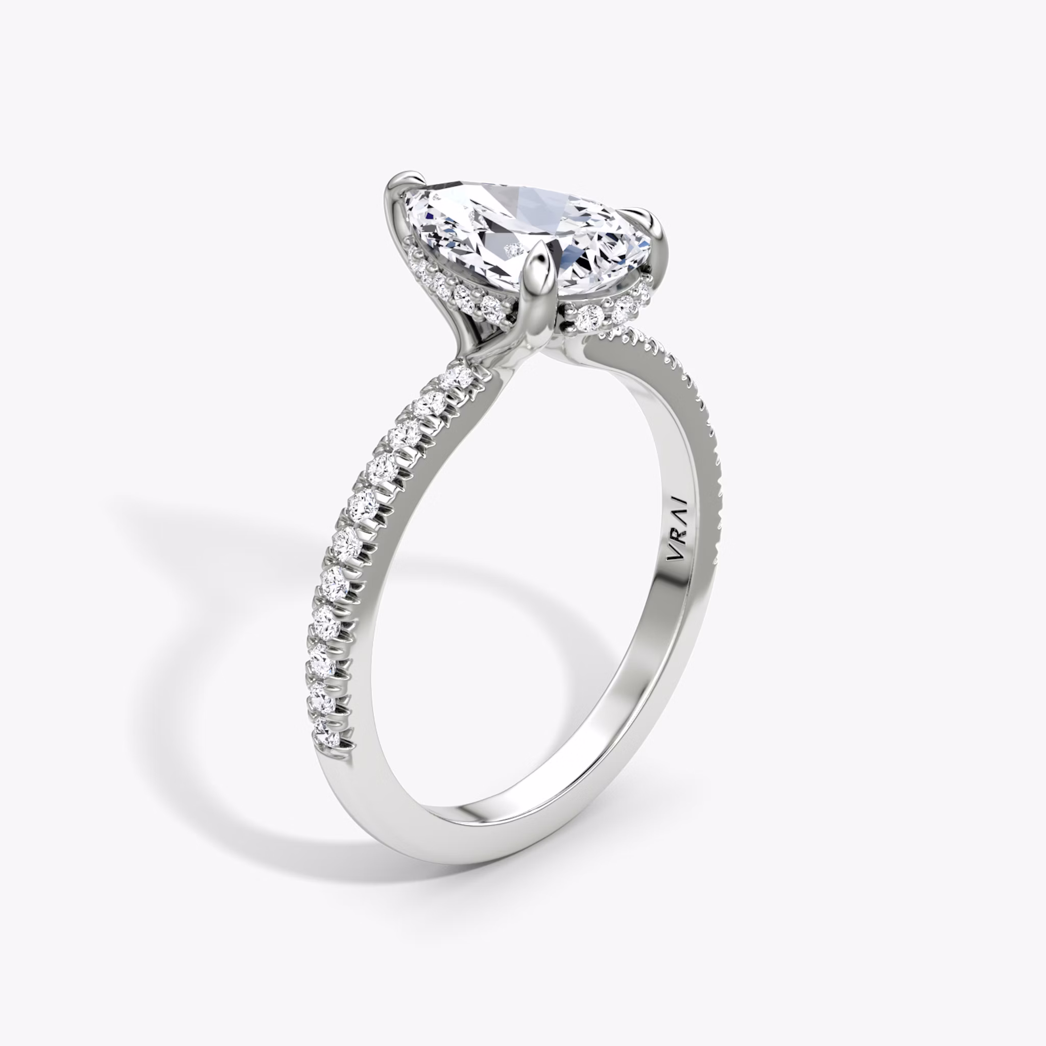 The Floating Solitaire | Pear | Platinum | bandAccent: Pavé | diamondOrientation: vertical | caratWeight: other
