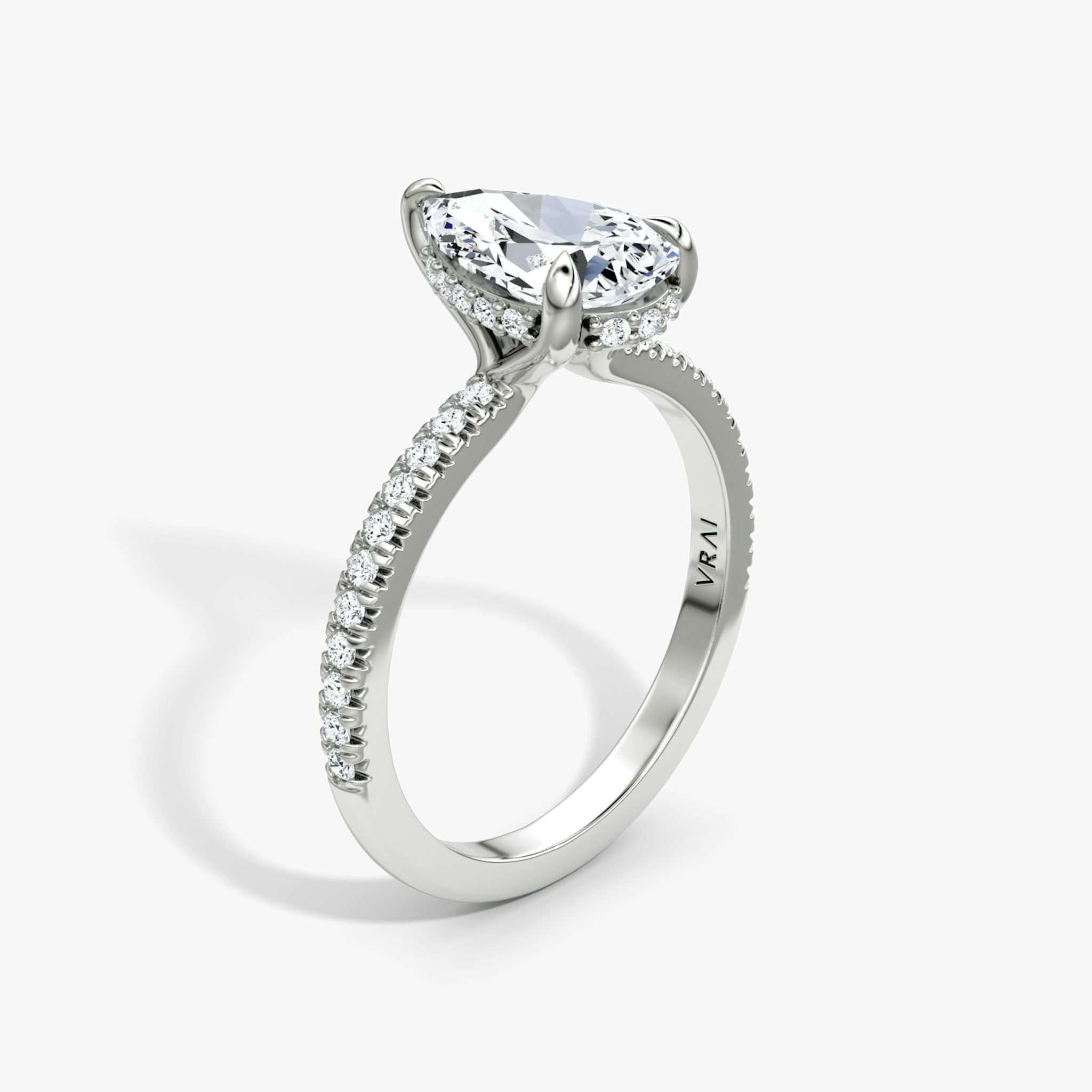 The Floating Solitaire | Pear | Platinum | bandAccent: Pavé | diamondOrientation: vertical | caratWeight: other
