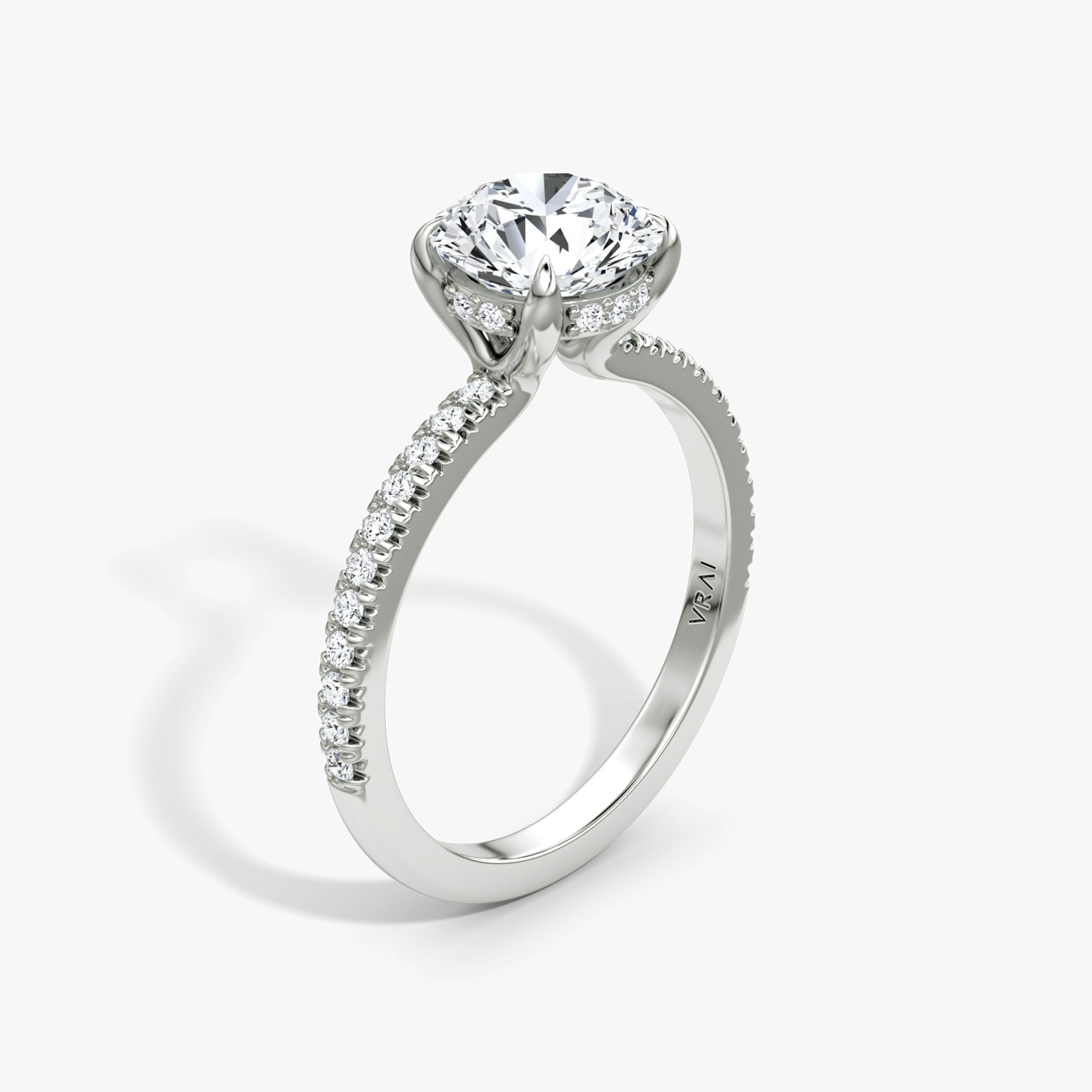 The Floating Solitaire | Round Brilliant | Platinum | bandAccent: Pavé | caratWeight: other | diamondOrientation: vertical