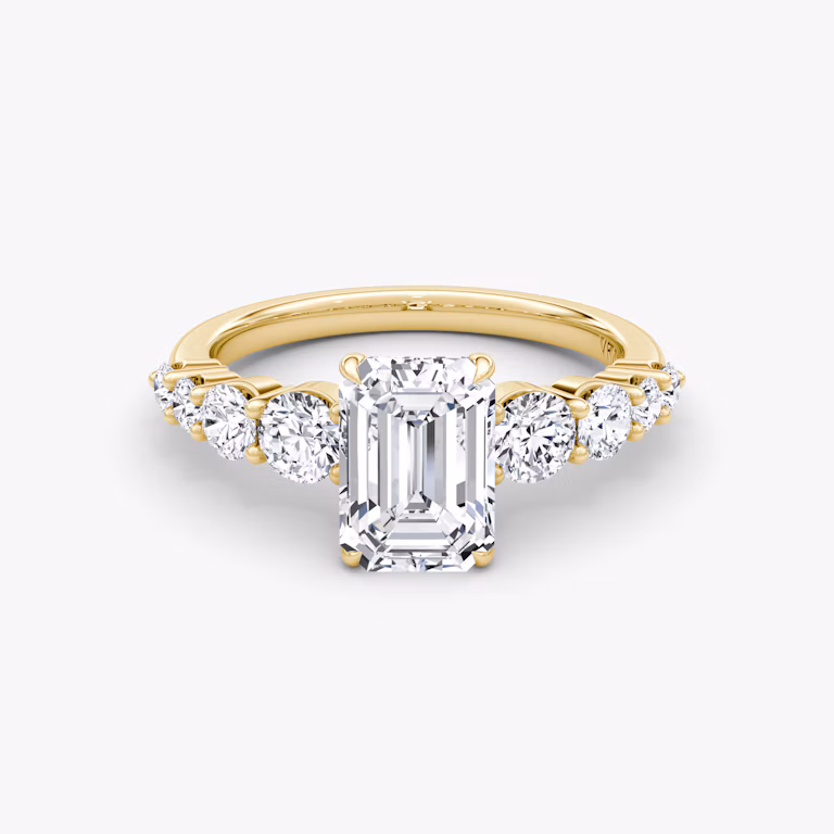 The Graduated Band Emerald Yellow Gold Engagement Ring.