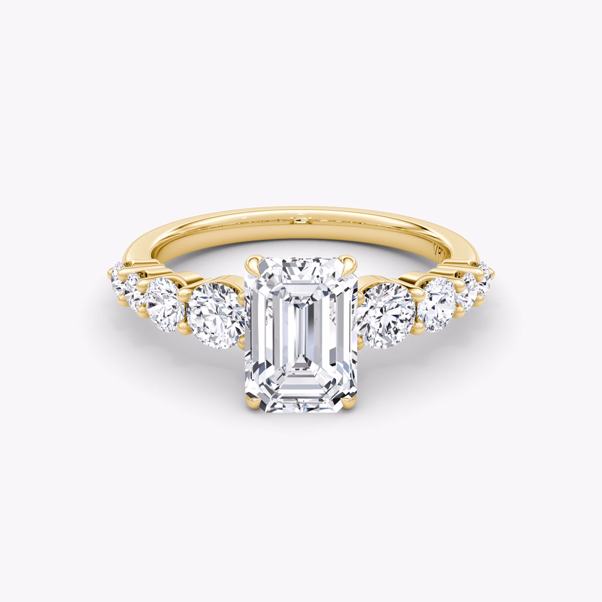 The Graduated Band Emerald Yellow Gold Engagement Ring.