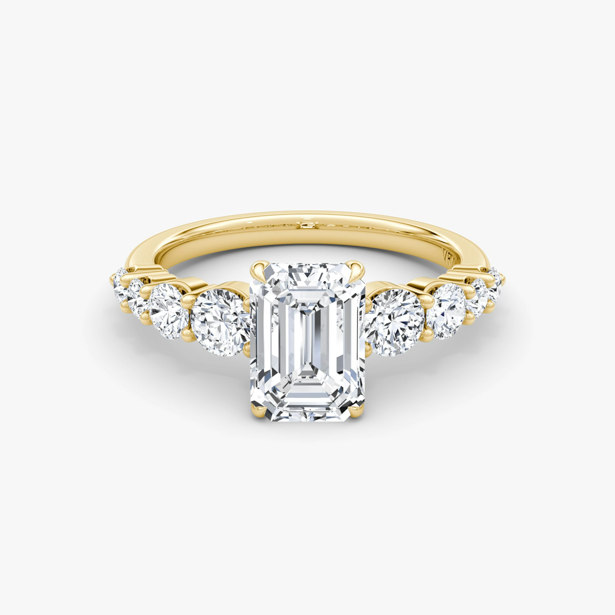 The Graduated Band Emerald Yellow Gold Engagement Ring.