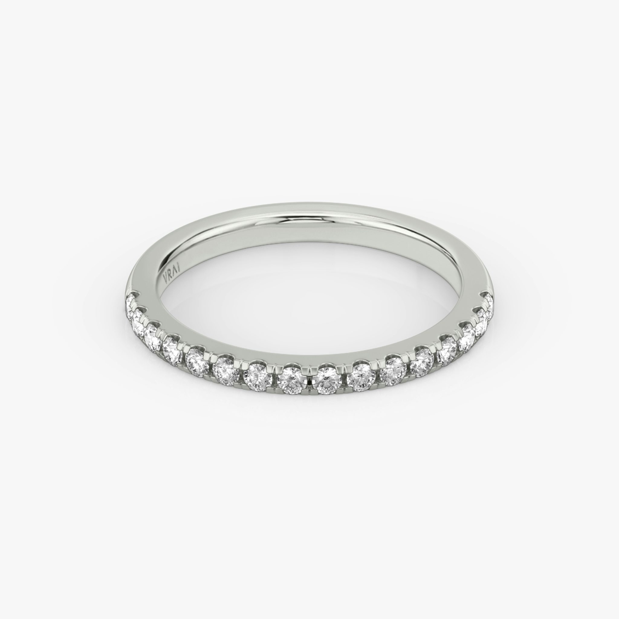 White gold pavé ring with pear-cut center diamond and halo setting, shown on white background.